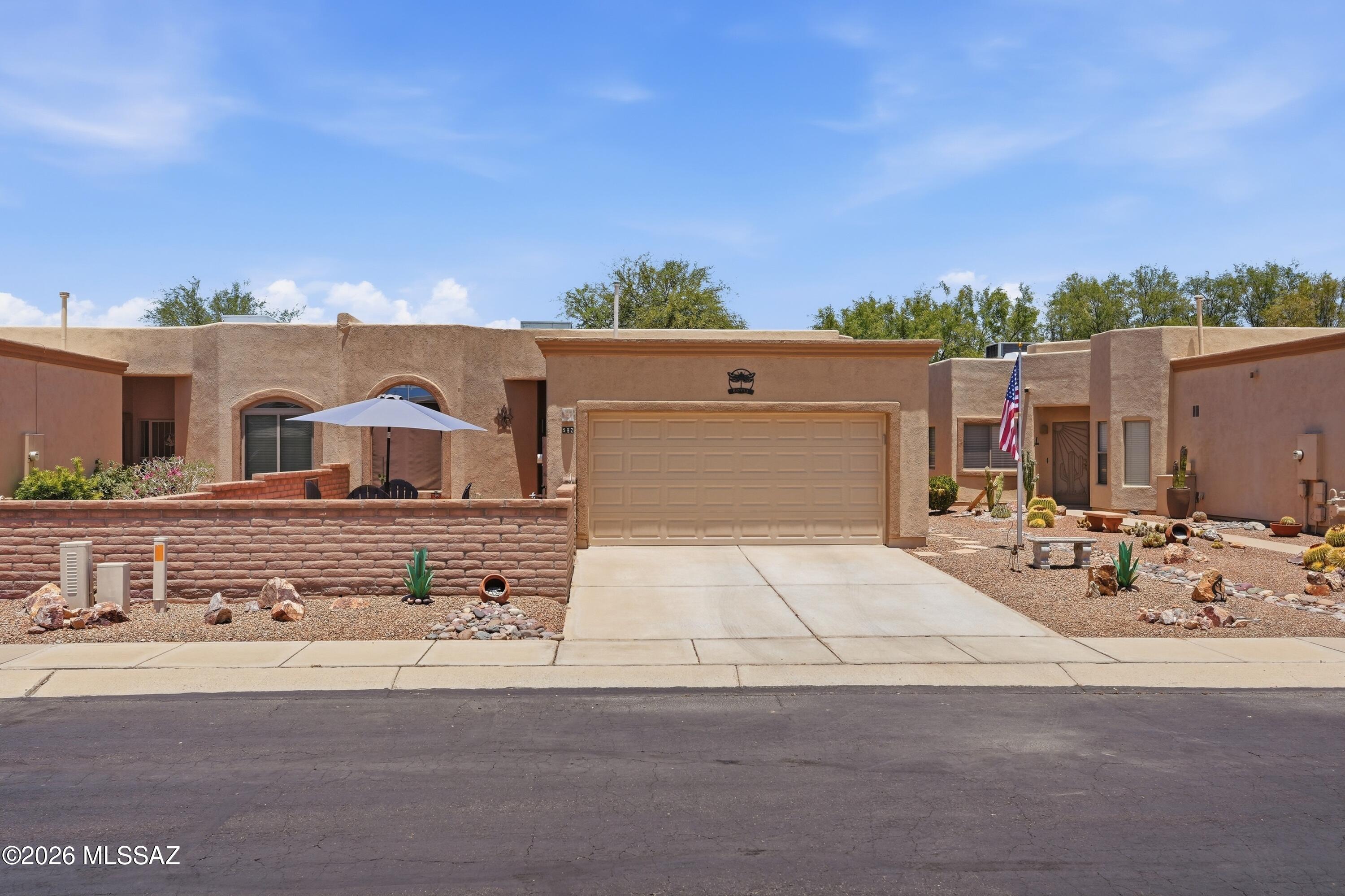 Desirable golf course locale for Active Adult Living at THE GREENS at SANTA RITA SPRINGS, a 55+, gated community.  Lovely light and bright updated home with Den/Office and covered rear patio on the green belt.  A Green Valley recreation 55+ community at Torres Blancas golf course.