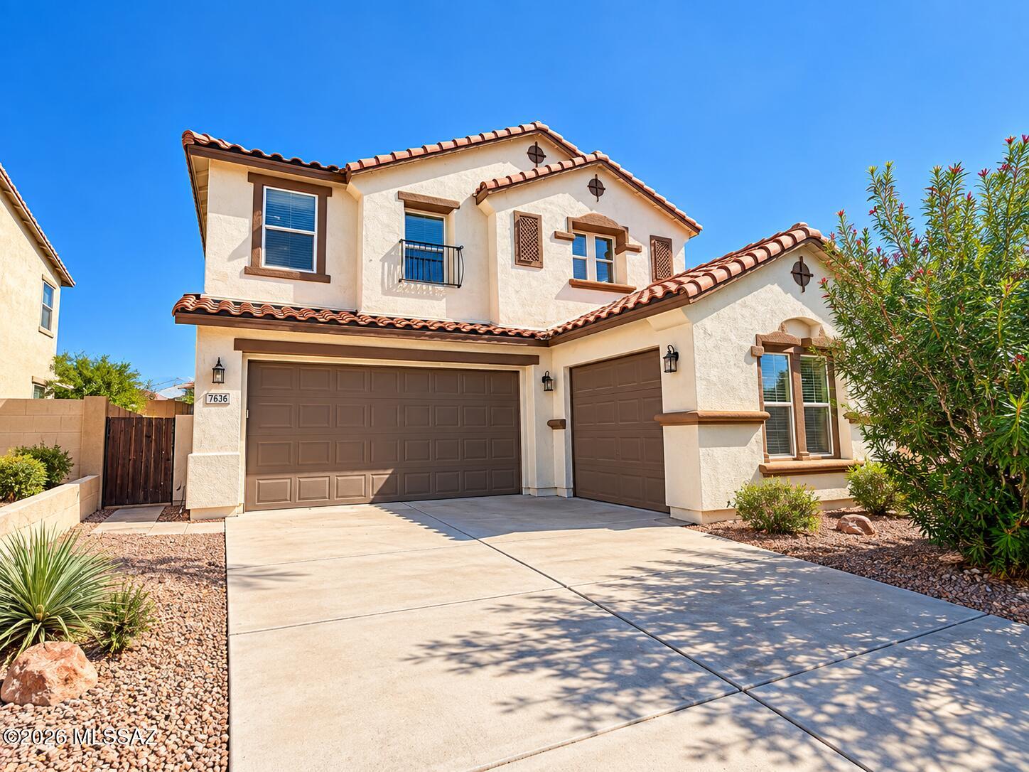 Rare opportunity in Rancho Sahuarita with an ASSUMABLE LOAN at an incredible 2.25% interest rate! This spacious 5-bedroom, 4-bath home with a 3-car garage offers an open floor plan, abundant natural light, multiple living areas, a cozy fireplace with built-ins, and a huge upstairs loft perfect for a game room, office, or second living space. The oversized backyard features turf, mature landscaping, and a covered patio, providing plenty of space for entertaining and enjoying Arizona living. Generously sized bedrooms, ample storage, and mountain views complete the home. Enjoy all that the Rancho Sahuarita community has to offer with convenient access to shopping, dining, schools, and more