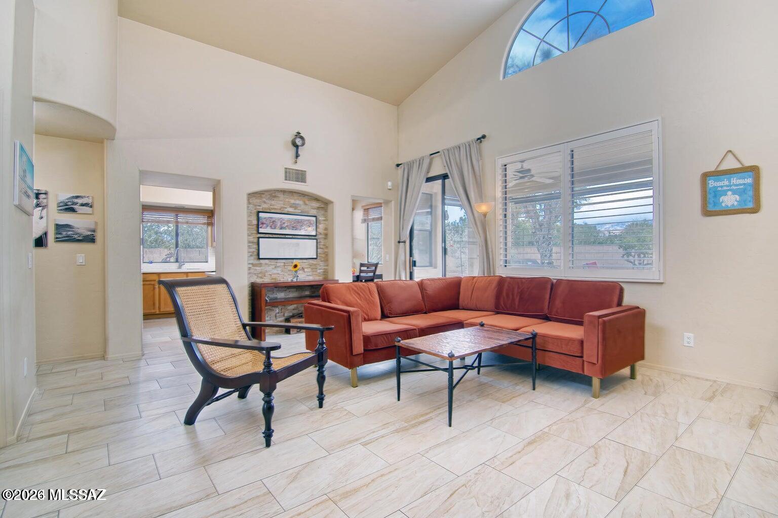 Well cared for & updated home located just off the PAR 3 3rd green of the El Conquistador Golf Course in Oro Valley. This home features a split bedroom floor plan for nice privacy and comfort, all situated on a large spacious lot. The living room features vaulted 14 ft ceilings & provides a nice comforting atmosphere. The MB features a spacious walk-in closet, dual vanities, garden tub, seamless glass doors/enclosure. Enjoy Catalina Mountain views from the backyard, living room and dining room.. This home has been renovated recently with  new couches, newer tile, Quartz countertops, plantation shutters & more. Call for seasonal rates and availability. All utilities included & new furniture added March 2024.Owner/agent is a licensed Realtor in the State of AZ.&CA.