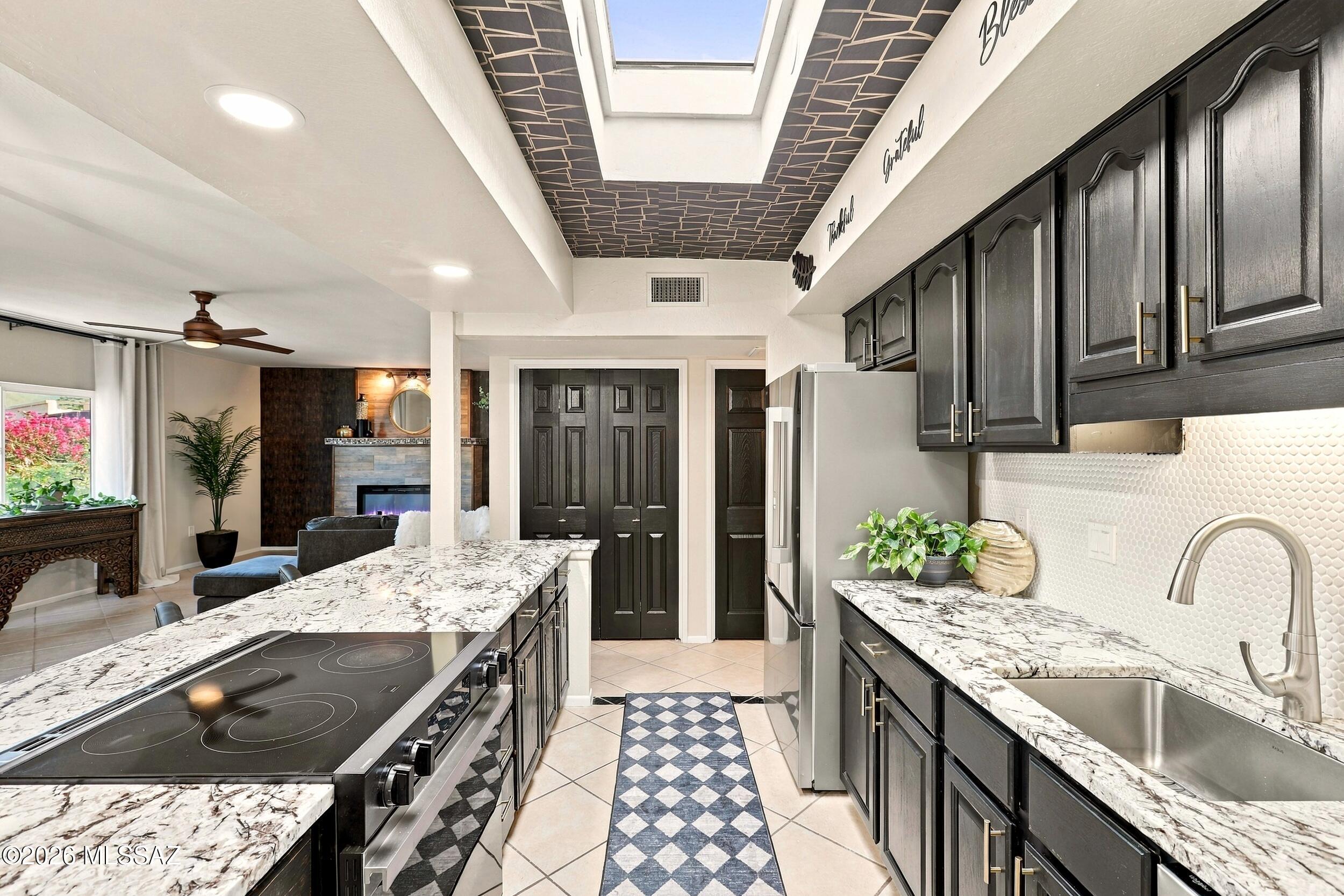 A rare find in Green Valley! Located in one of Green Valley's established communities, 1866 Abrego is anything but ordinary. This one-of-a-kind home blends timeless character and class with a complete top-to-bottom remodel featuring granite countertops, updated cabinetry, new appliances, modern lighting, and beautifully renovated bathrooms with a stunning primary walk-in shower. The redesigned kitchen offers an open, inviting feel, while elegant French doors lead to a 400 sq. ft. enclosed sunroom. Enjoy two living areas, dedicated his-and-hers hobby rooms or private offices, and mountain views from the front window. Situated on a generous 1/3-acre lot with mature trees, and refreshed landscaping, this home offers a unique blend of charm, space, and modern comfort. A must see property!!