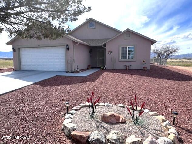 Welcome to this charming home in a quiet, peaceful neighborhood where you can enjoy relaxing walks along the village streets and breathtaking desert scenery. This 3 BR, 2 BA home offers a spacious living room and a recently added AZ room that perfectly captures the magical, unobstructed views of the iconic Cochise Stronghold and historic Dragoon Mountains.
The home has been well cared for with several recent updates, including a complete new roof approximately 4 years old and fresh exterior paint completed in 2025. The Rheem A/C unit and Rheem furnace are serviced annually. The stove and built-in microwave are 1 year old, and the dishwasher and washing machine are 2 years old. The backyard is fully chain-link fenced with a large access gate and offers 2 large outbuildings on cement slabs- -a storage/workshop and a large double-door workshop that's perfect for a side by side, quads, tools or projects. The home also has a 2 year old water softener.

Whether you're enjoying the peaceful surroundings, watching the unbelievable sunsets, or simply relaxing in the Arizona room, this home offers the beauty and tranquility of true Arizona living. 

Come experience the views and peaceful atmosphere for yourself before it's gone.