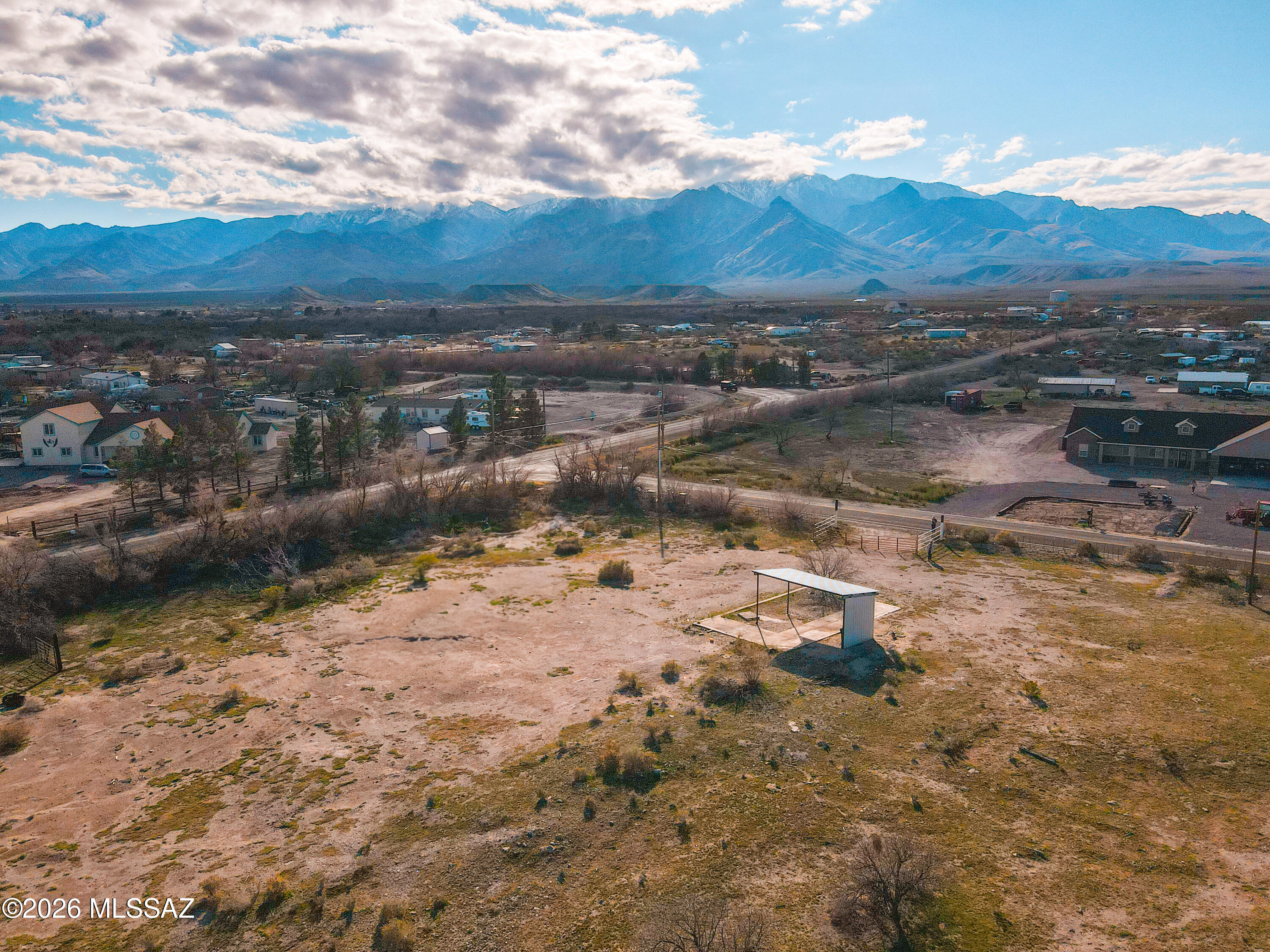 2.52 Acres with Utilities, Structures & Stunning Mt. Graham Views. Build your dream home or ranch on this 2.52 acre property featuring amazing views of Mt. Graham and essential improvements already in place. With all utilities ready and available, including a private well, electricity, and septic system. This property is primed for immediate use. Property Highlights include two partial steel barns, ideal for equipment storage or hay. Fenced corral area ready for horses. Gated access for added privacy and security. Open, usable land with a mix of level areas and natural vegetation. Peaceful rural setting with wide-open skies and mountain backdrops.Whether you're looking for a homesite, hobby farm, or a place to store your toy hauler, this land offers the infrastructure, space, and views.