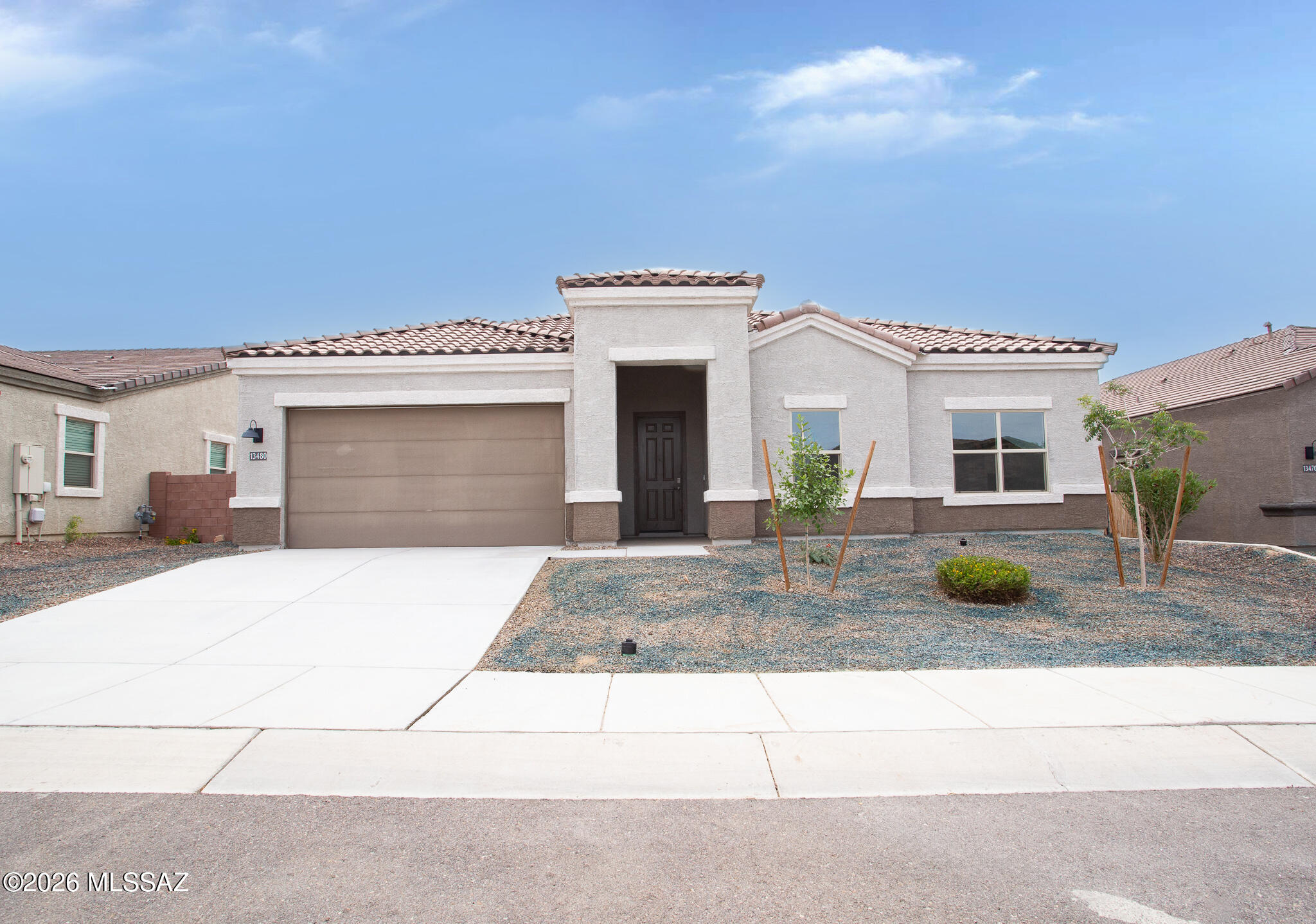 Nestled in the beauty of the Tortolita Mountains and one of the most sought-after floor plans in Tortolita Ridge subdivision. With over 2577 sq ft of living space, this home offers 4 bedrooms plus a den/office and 3 bathrooms, providing comfortable living space for those seeking room to grow. The thoughtful layout provides distinct areas for daily living and entertaining. This floor plan has a grand and open living design with a gourmet kitchen, 11-foot quartz kitchen island, and tiled backsplash. Features include stainless steel appliances, tons of cabinetry, a tankless water heater, electric vehicle charging hookup, an enclosed patio, and a backyard with a covered patio, pavers, and artificial grass. This is a HomePath property. Move-in ready! Contact Agent for more details. First-time buyers, complete the HomePath Ready Buyer homeownership course on Homepath.com. Attach the certificate to your offer for up to 3% closing cost assistance. Check HomePath.com for more details. Restrictions apply.