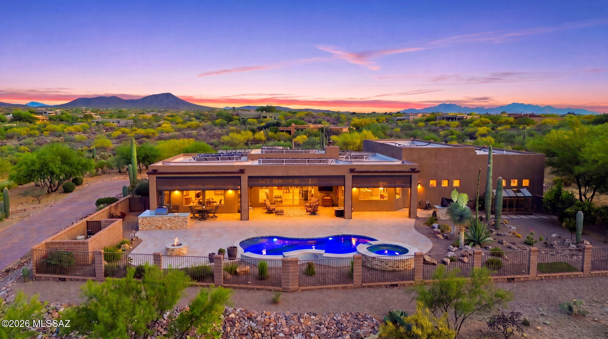 Seller Incentives Available | Custom Luxury Home for Sale in Vail, AZ. Some homes check boxes. This one rewrites the list entirely.
Inside the gated Coyote Creek community, this 3-bed, 4-bath, 2,691 sq ft custom home sits on 1.67 acres of Sonoran Desert built without compromise. A heated saltwater pool, spa, travertine patio, outdoor kitchen with dual-fuel BBQs, quartz counters, & fire pit make entertaining effortless. Inside, natural stone finishes, Monogram appliances, & whole-home surround sound set an unmistakably luxury tone.Then there's the shop. Over 2,000 sq ft of climate-controlled space with an office, bathroom, & its own garage. Use it for your collection, your craft, or see the floor plan mockup in documents to envision it as a private guest house.Paid solar. 400-amp service. Welcome to 15070 E Triangle Z Ranch Place, Vail, AZ -- A Custom Luxury Home in the Heart of Coyote Creek

Some homes are built. This one was crafted.
Set within the gated community of Coyote Creek in Vail, Arizona, this 2019-built custom home offers 2,691 square feet of thoughtfully designed living space on a 1.67-acre desert lot. From the moment you arrive, the grand double-door entry sets the tone -- this is a home where every detail was chosen with intention.

Indoor Living That Feels Like a Resort
Step inside and you're greeted by an open-concept layout that connects every space seamlessly. Tile floors accented with natural stone flow throughout the main areas, while expansive windows frame sweeping views of the desert & mountains beyond. The great room centers around a gas fireplace & a built-in surround sound system that extends to the primary suite & covered patio -- so the atmosphere follows you wherever you go.

The kitchen is where this home truly shines for those who love to cook & entertain. Solid wood cabinetry, granite countertops, & professional-grade Monogram appliances create a space that's as functional as it is beautiful. The 16-foot breakfast bar features soft-close drawers, spice racks, & pull-out storage -- and the large refrigerator stays with the home. The open layout flows directly to the dining area & outdoor patio, making hosting effortless.
The primary suite is a true retreat. Remote-controlled shades, integrated audio, & serene views of the pool & backyard make it easy to unwind. The en suite bath features dual vanities, a seated makeup area, a linen closet, & a custom snail-style walk-in shower crafted with natural stone. Every element reflects the same commitment to quality found throughout the home.

Additional bedrooms include a full guest room with a tile-surround bath & a private guest suite with a half bath. A separate den with French doors rounds out the interior -- perfect as a home office, media room, or library.

Outdoor Living Designed for the Arizona Lifestyle
The backyard of this Vail luxury home is nothing short of spectacular. The heated saltwater pool & spa, completed in 2025, are surrounded by elegant travertine decking that stays cool underfoot. The covered patio features ceiling fans, an outdoor TV, & a full sound system -- so the entertainment never has to stop when the sun goes down.
The outdoor kitchen is a chef's dream under the open sky. It features both gas & Santa Maria-style wood BBQs, a built-in oven, quartz countertops, & abundant storage. Gather around the custom gas fire pit on cool desert evenings, surrounded by a fruit orchard & mature desert landscaping. The lot is partially fenced & designed to manage water flow efficiently, blending privacy with practical desert living.

The Shop -- A Space Unlike Any Other
Here is where this property separates itself from everything else on the market.

Integrated directly into the home's structure is a 2,000-square-foot climate-controlled shop -- approximately 40' x 49'9'' -- that is completely insulated, heated, & cooled. With 200-amp service, multiple 220V outlets, four mini-split units, & extensive lighting, this space is ready for serious work or serious play. Whether you're a collector, a contractor, an entrepreneur, or a hobbyist, this shop delivers a level of function that most properties simply can't offer.
A private office with its own bathroom, ceiling fan, & TV wiring makes it ideal for running a home-based business. Oversized roll-up access & an automatic locking system ensure it's as secure as it is versatile.

And here's the part that really opens up the possibilities: see the floor plan mockup in the documents tab. With its own garage, office, & bathroom already in place, this shop could be converted into a fully independent guest house -- creating multi-generational living, rental income potential, or a private retreat for visitors.

Built for Performance & Peace of Mind
This home isn't just beautiful -- it's smart. Forty-six paid solar panels dramatically reduce utility costs, & a 400-amp electrical panel supports high-demand equipment & appliances throughout the property. Two HVAC systems, two furnaces, a new water heater installed in 2025, & a water softener ensure year-round comfort. The septic system has been completely upgraded with dual leach lines & a new pump system valued at $20,000. The roof was professionally sealed & the exterior received a three-coat paint finish in 2024 -- making this home move-in ready for years to come.

The Community & Location
Coyote Creek is one of Southern Arizona's most desirable gated communities -- known for wide-open desert views, equestrian amenities, & miles of scenic trails. Located within the award-winning Vail School District, the community offers privacy & security without sacrificing access to everything Tucson has to offer.

This is desert ranch living at its finest -- independent, refined, & completely self-sufficient.

Seller Incentives Available. Ask Your Agent for Details.
See the documents tab for the full list of features.