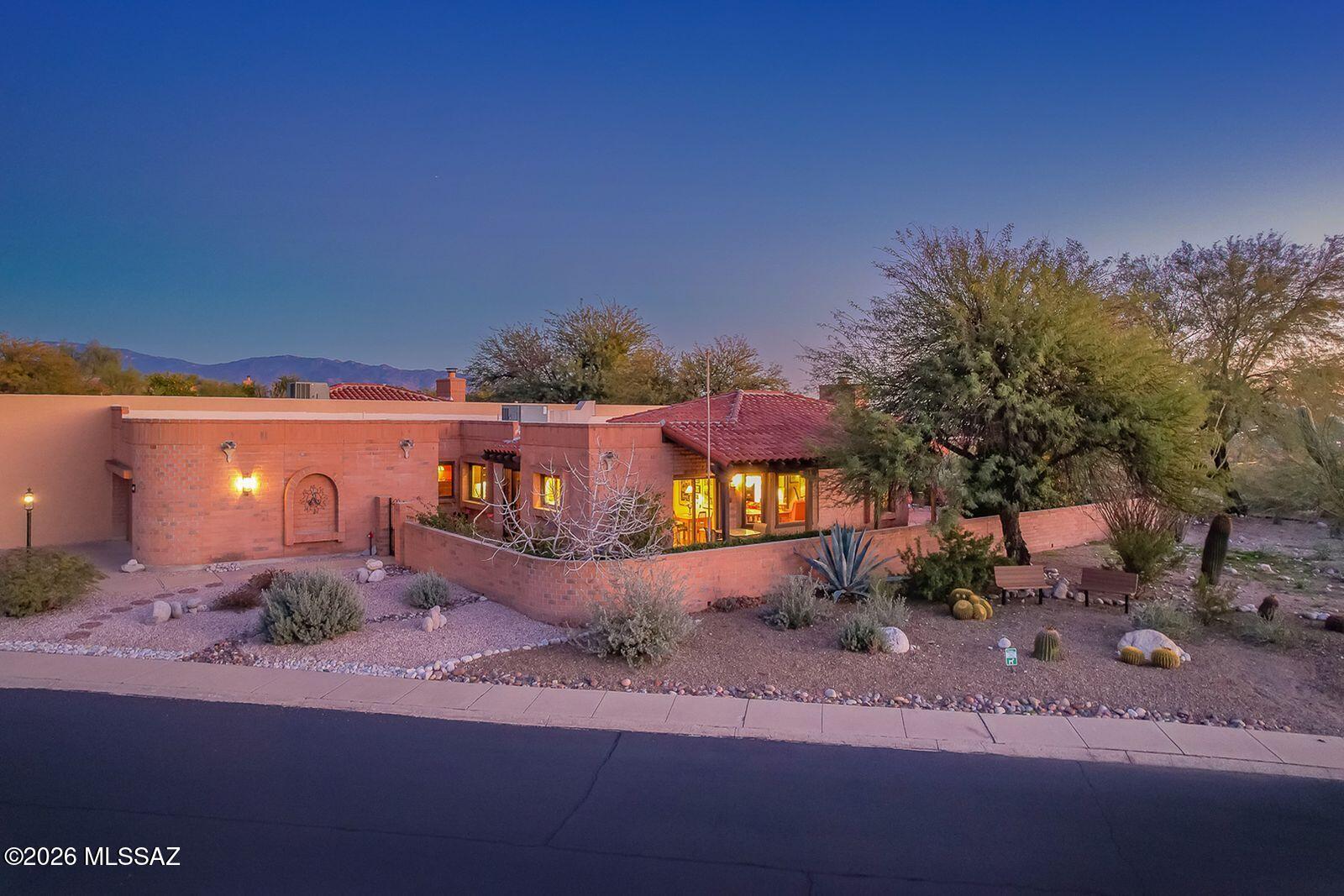 Welcome to Fairfield in the Foothills-one of Tucson's most sought after communities. This nicely updated & exceptionally cared for home near Sabino Canyon offers peaceful desert living. Surrounded by lush natural desert with stunning city lights and sunset views. Mountain views to the north. High ceilings. Custom kitchen cabinets & drawers, tile throughout. Tastefully selected tile finishes in both bathrooms. The 3rd bedroom currently used as office. Brand new roof. Newer windows & doors. Sliding doors to covered patio's frame breathtaking city lights and sunset views-perfect for relaxing and entertaining.. Enjoy your very own grapefruit, orange and kumquat trees. This vibrant community offers 2 pools, spa, tennis & pickleball, and bocce ball. Restaurants, shopping, endless hiking near by.
