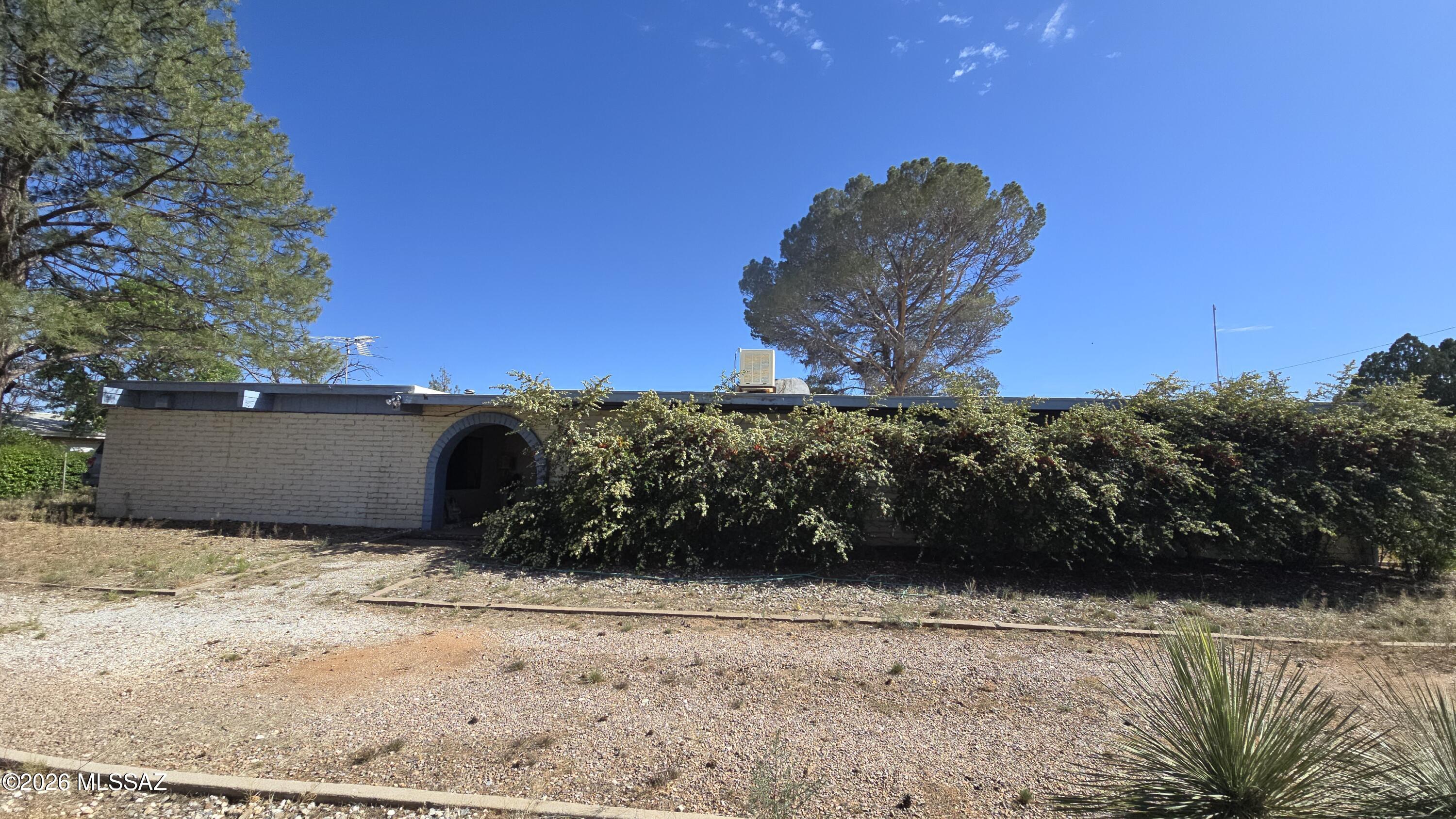 This fixer-upper in Sunsites, Arizona offers 2,293 square feet of potential on a generous .86-acre lot, plus a large detached garage with alley access. The home needs a lot of work and cosmetic updates throughout, and it's not charming in its current condition, but it presents a rare chance for the right buyer to design and renovate from the ground up. The quiet neighborhood provides a tranquil desert setting with plenty of outdoor space for projects, gardens, or future additions, and the sizable lot offers room to spread out and pursue ideas. Investors or buyer-owners who are prepared to roll up their sleeves can transform this property into a personalized oasis. Sold as-is , Seller will make no repairs or clean up . Septic system will be inspected by Seller.