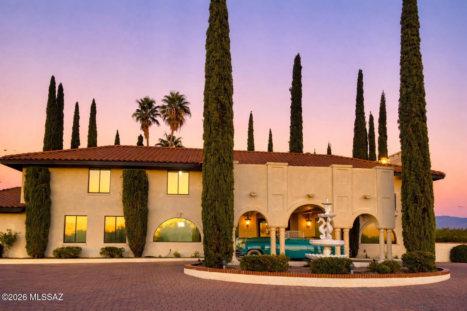A Legacy Estate - Reimagined for Modern Living! Originally built as the personal residence of one of Arizona's respected custom home builders, this remarkable estate is a rare blend of heritage craftsmanship and contemporary luxury. Thoughtfully and completely remodeled, this 4,862 square foot two-story home sits on 2.63 acres, offering privacy, beauty, and refined living. A grand double staircase creates a stunning first impression, leading into expansive, light-filled interiors accented by three fireplaces and all new flooring throughout. Two new A/C-Furnace units, and a finished garage floor. Every detail has been updated with care, including brand-new appliances and timeless finishes that honor the home's original character while embracing today's lifestyle. The residence features spacious bedrooms, three beautifully updated bathrooms, and a  three-car garage and three additional carports. Outdoors, serene mature grounds invite relaxation and entertaining, highlighted by a tranquil rock fountain, koi pond and sweeping open space - perfect for gatherings, quiet mornings, or future possibilities. Topped with a newer classic tile roof and infused with thoughtful design, this is more than a home - it's a legacy property now offered for its next chapter. A truly rare opportunity to own the original builder's home, completely reimagined.