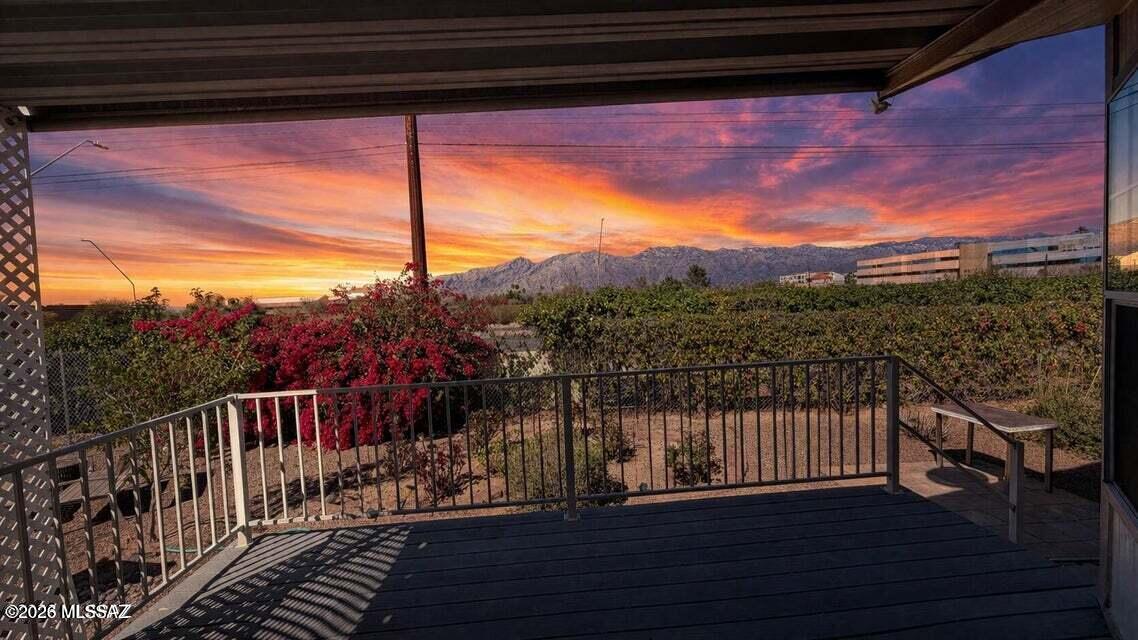 Perched to capture breathtaking, unobstructed views of the Catalina Mountains, this beautifully designed home offers space, comfort, and unforgettable indoor-outdoor living. Soaring ceilings, an expansive living area, and a grand dining space with a private patio create the perfect setting for entertaining or peaceful evenings under Arizona skies. A stunning Arizona room wrapped in windows invites natural light and panoramic views year-round. Thoughtfully designed with abundant storage, a spacious primary suite, guest accommodations, and ADA accessibility, this home blends function with elegance. Complete with multiple workshops, sheds, and ample covered parking--this is elevated desert living at its finest. This is a CO-OP; every owner has ownership in the park.