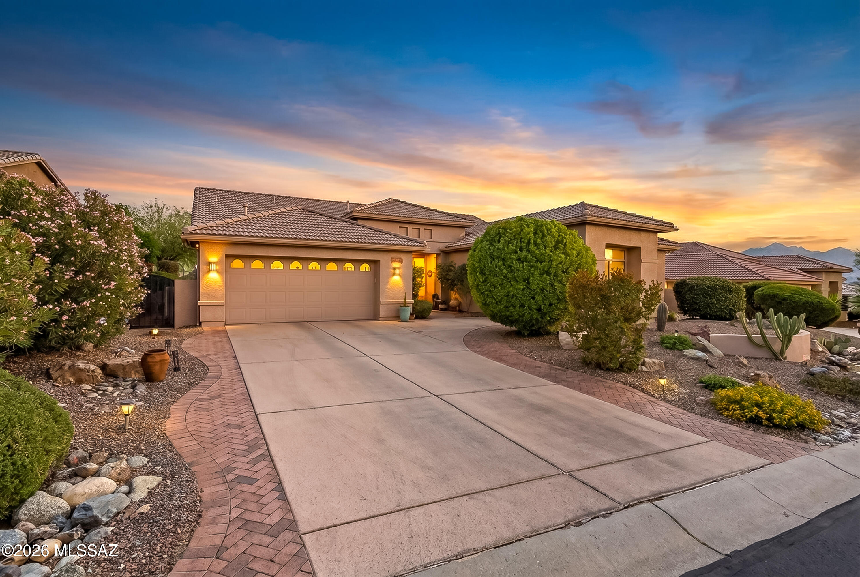 This is it! Welcome to Saddlebrooke, one of Arizona's premier retirement communities. This Dakota floor plan features unobstructed mountain views and a well-designed split layout with three bedrooms, two bathrooms, and generous living space throughout. The spacious kitchen includes abundant cabinetry, granite countertops, a gas range, and a center island.

Step outside to a large patio with low-maintenance landscaping and stunning mountain views, perfect for relaxing or entertaining. The epoxy-coated driveway and garage with built-in storage add both style and function, while the third garage offers flexibility for a studio, workshop, or golf cart. This is it! Welcome to Saddlebrooke, one of Arizona's premier retirement communities. This Dakota floor plan features unobstructed mountain views and a well-designed split layout with three bedrooms, two bathrooms, and generous living space throughout. The spacious kitchen includes abundant cabinetry, granite countertops, a gas range, and a center island.

Step outside to a large patio with low-maintenance landscaping and stunning mountain views, perfect for relaxing or entertaining. The epoxy-coated driveway and garage with built-in storage add both style and function, while the third garage offers flexibility for a studio, workshop, or golf cart.

Residents enjoy a wide range of amenities, including golf, swimming, pickleball, concerts, and more. Experience breathtaking views and everything this exceptional community has to offer.
