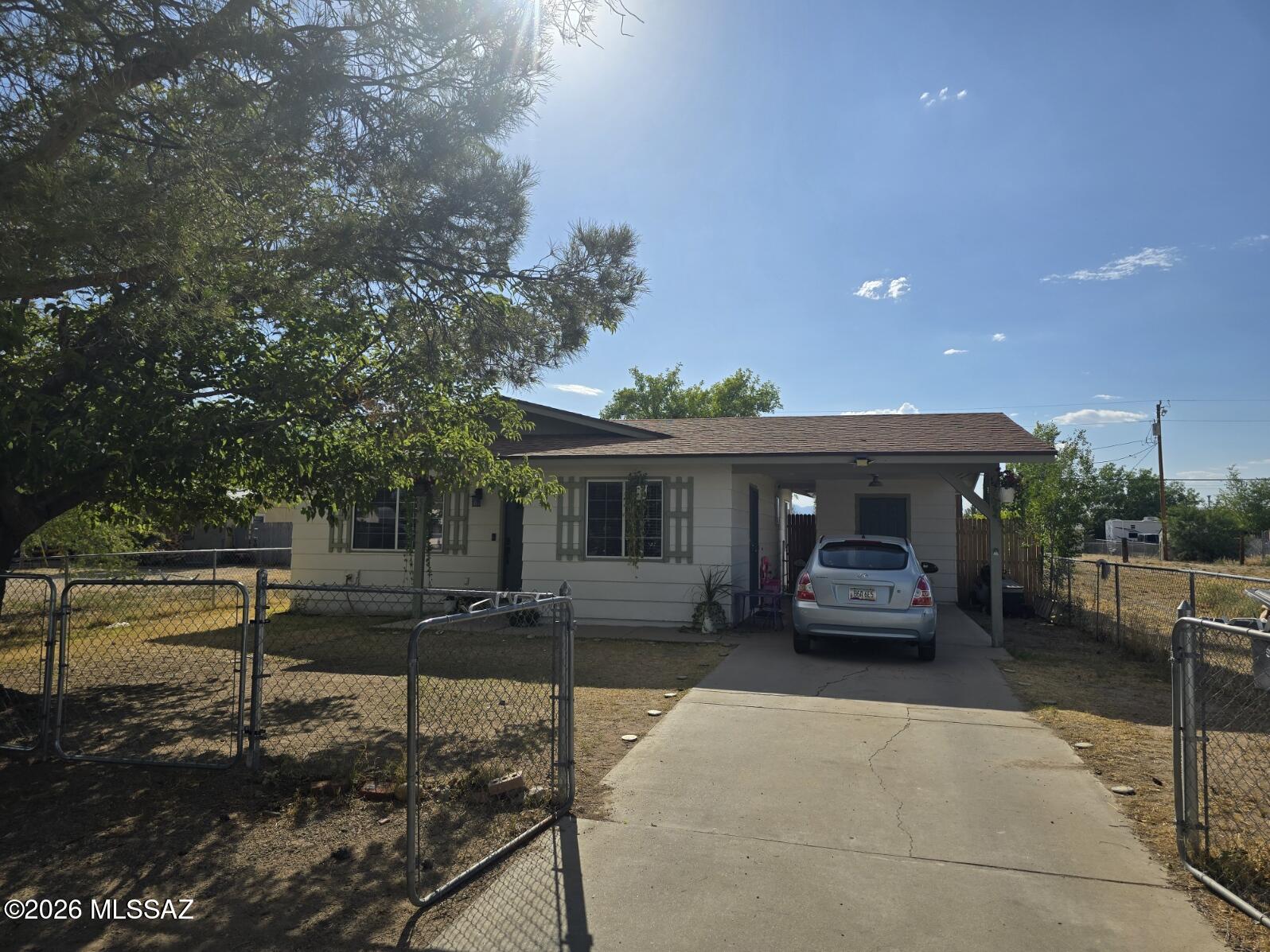Great Home/Great Price/Great Location! This 2 bed 1 bath home has been completely remodel. Located in a quite neighborhood, and is close to all amenities. Home has a new roof and HVAC. The kitchen has been upgraded with custom cabinets that have inserts and rollouts, finished with gorgeous granite countertops and new appliances.  Large backyard that is fenced and cross fenced and has double gates in back yard for easy alley access and has a metal shed with a concrete floor and shelving for storage. Lovely Outdoor sitting area that is finished with pavers and a small fire pit to enjoy our amazing arizona evenings.. There is also an additional storage room under the carport. Washer and Dryer are included . This home has been updated in all the right ways and is ready for it's new owners!