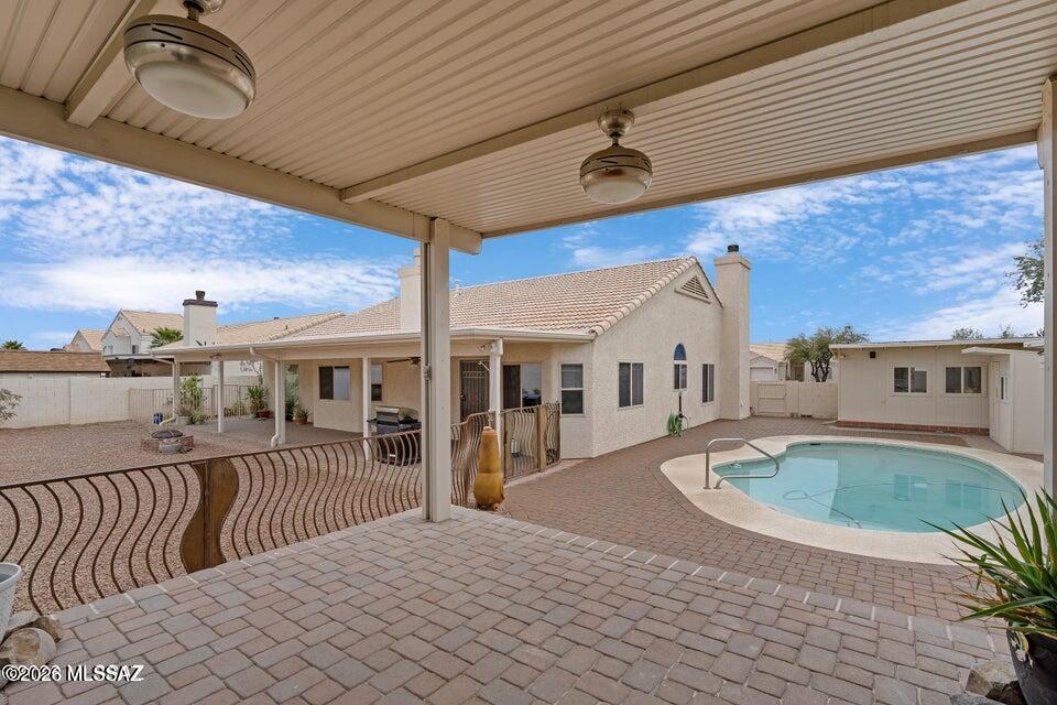 Discover an exceptional Northwest retreat where thoughtful upgrades & resort-style outdoor living come together with RV parking & the freedom of no HOA. Offering 4 spacious bedrooms plus a versatile den with a closet that can easily serve as a 5th bedroom or home office. Open kitchen serves as the heart of the home, featuring stylish finishes perfect for both everyday living & entertaining. Updated bathrooms with elegant double vanities create a spa-like experience. Energy-efficient paid solar and a newer 50-gallon water heater provide modern convenience & long-term value. Backyard features private sanctuary where every day feels like a vacation. Sparkling pool newer pump and filter, invites refreshing afternoons. Unwind beneath the covered patio or gather with friends in the cabana. Enjoy your favorite music through the outdoor sound system as the sun sets. The workshop and pool pump house add functionality, while available RV parking offers flexibility for adventure seekers. Mature lemon, lime, orange, and pomegranate trees create a lush backdrop and provide fresh fruit right from your backyard. Imagine starting your mornings with coffee on the patio surrounded by fragrant citrus blossoms and ending your evenings poolside beneath a colorful Arizona sunset. Designed for both relaxation and entertaining, this remarkable property delivers the lifestyle you've been dreaming of--private, inviting, and truly unforgettable. NO HOA!