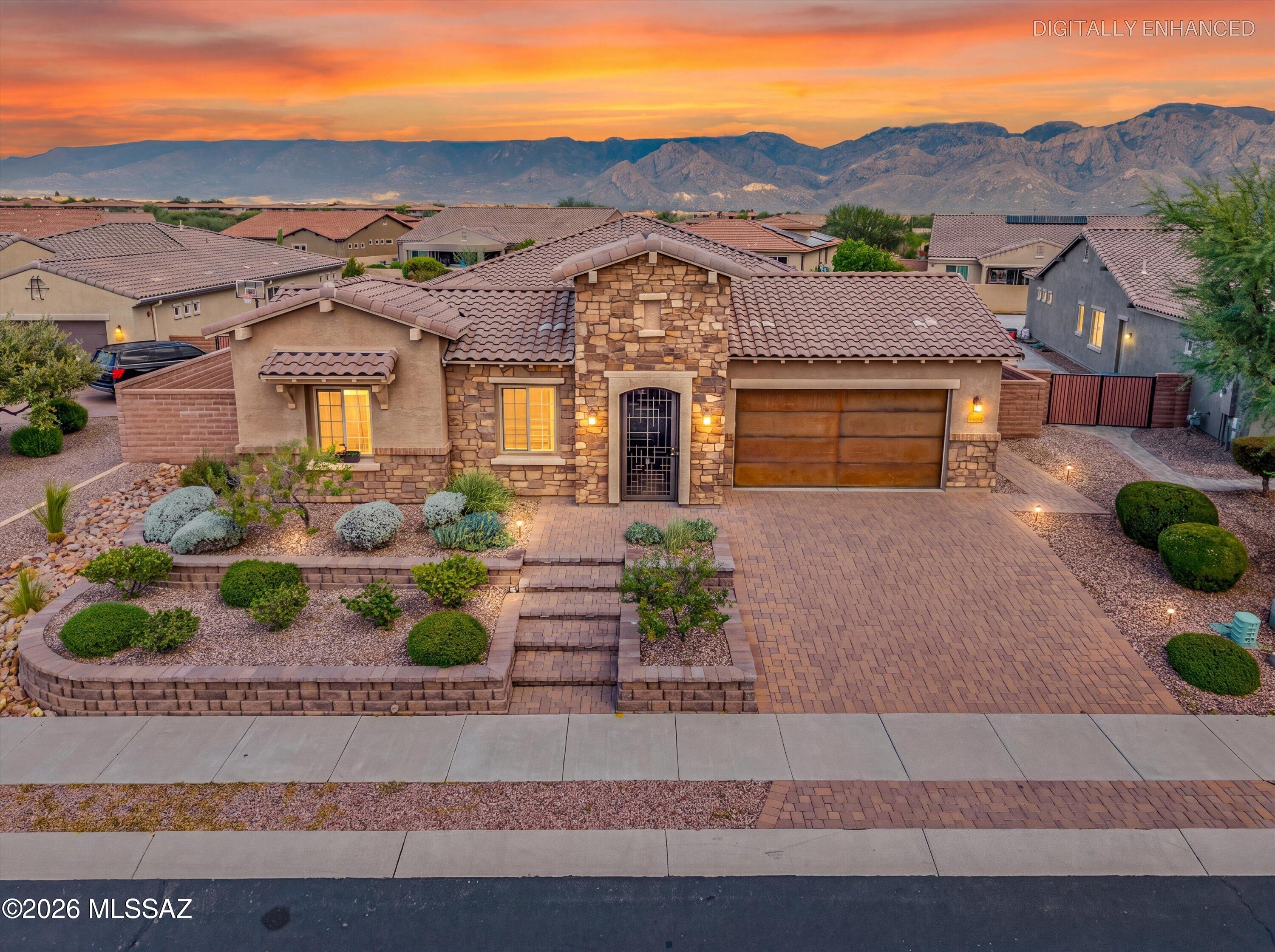 Model-like home in the gated Pinnacle at Center Pointe in Rancho Vistoso! Enter through a private gated courtyard into this beautifully appointed 4-bedroom, 3-bath home offering 3,041 sq. ft. of thoughtfully designed living space. The inviting floor plan features a great room concept, formal dining area, private den with built-ins and double doors, and a dedicated laundry room. The chef's kitchen boasts rich dark wood cabinetry, granite countertops, stainless steel GE appliances, gas cooktop, oversized island with breakfast bar, and walk-in pantry. The spacious primary suite offers dual vanities, a large walk-in shower, generous walk-in closet, and separate walk-in storage closet. A private secondary living area with its own bathroom provides an ideal retreat for guests or..(MORE).. .....multigenerational living. Sliding glass doors from the dining area and family room open to an expansive 1/3-acre lot with stunning Catalina Mountain views, a large artificial turf area, mature landscaping, covered patio, and ample space for a future pool. Additional features include a 3-car tandem garage and water softener. Enjoy Center Pointe amenities, including a community center, 25-meter lap pool, in-ground spa, splash pad, outdoor kitchen with covered gathering area, parks, and access to the 6.2-mile paved Vistoso Nature Trail. Conveniently located near schools, biking paths, restaurants, shopping, Oro Valley Hospital, and Oro Valley Marketplace. Enjoy the perfect blend of comfort, space, and community living in desirable Rancho Vistoso!