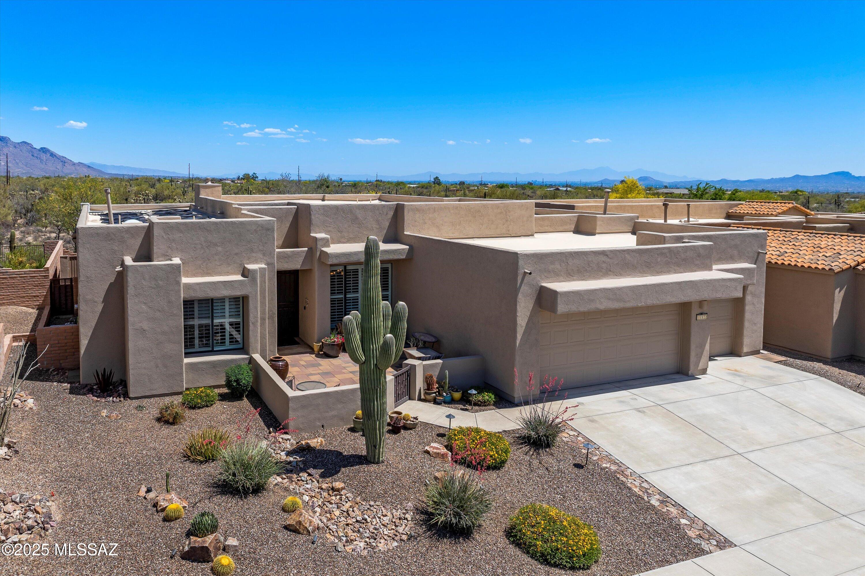 Welcome to your dream home in the highly coveted community of Sky Ranch! Located in a gated enclave, and nestled against protected natural open space, this Marc Soloway-designed masterpiece offers breathtaking mountain and desert views. With 3,515 square feet of thoughtfully designed space, this home features a great room floor plan with a split bedroom layout, including four en suite bedrooms and a versatile fifth bedroom that is perfect for an office or den. Expansive windows flood the interior with natural light, highlighting the soaring ceilings and seamless connection to the surrounding landscape. The chef's kitchen is a showstopper with double ovens, gas cooktop, stainless steel appliances, elegant granite countertops, pull-out shelving and a stone backsplash. Step into your private backyard oasis, beautifully upgraded in 2023 with a solar heated, saltwater pool, spa, and outdoor kitchen. Additional enhancements made in the last five years include a newer HVAC, water heater, interior and exterior paint, and a complete roof re-coat in 8/2025. Stunning curb appeal welcomes you with low maintenance landscaping, a charming front courtyard, and a spacious 3-car garage. Located in a beautifully maintained community where all homes are single story.