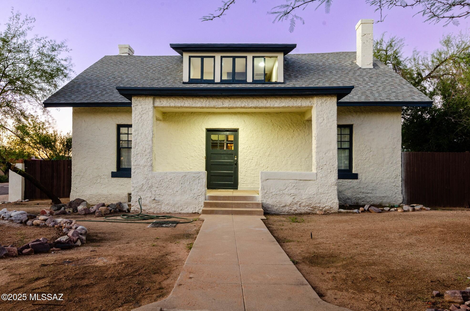 Beautifully rehabilitated historic two story home in Tucson Sought after West University Neighborhood, Cornet Lot, just minutes from U of A and downtown. Features 3 bedrooms and a Flexible den/office, 3 full baths and 1 half bath. Light and open living and dining areas leading up to and updated kitchen Blending modern style with historic charm. enjoy the private backyard with a pool and a gazebo, ideal for relaxing and entertaining.  Don't miss this rare oppotunity to own a historic property with the perfect balance of  character, comfort and location.