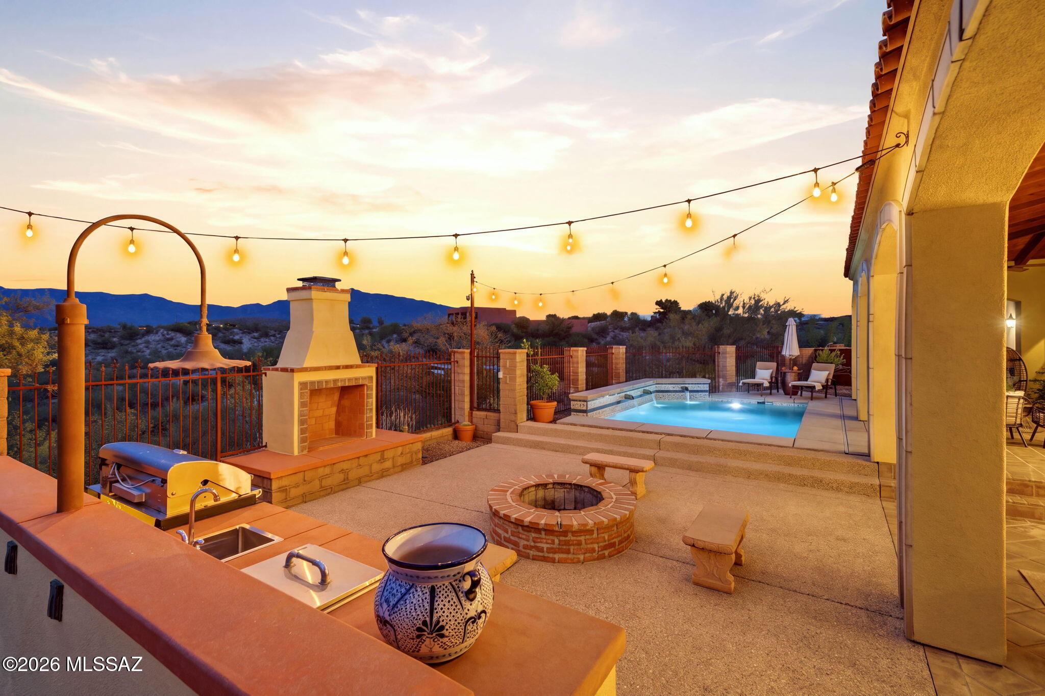 Perched on an elevated 1.13-acre homesite with sweeping, unobstructed desert and mountain views, this exceptional property delivers the space, privacy and Arizona lifestyle that are increasingly difficult to find. With more than 3,600 sq ft this home offers 4 bedrooms, 2.5 interior baths, a dedicated downstairs  and upstairs office/bonus rooms and generous living spaces designed for both everyday comfort and entertaining. Showcasing a gourmet kitchen with large island and eating area, formal living room, formal dining area, and large laundry room. The backyard is the true showpiece! Step outside to a private resort-style setting featuring a sparkling pool, expansive covered patio, multiple gathering areas, a dedicated fire-pit conversation space and breathtaking sunsets across the open desert landscape. An additional exterior half bath adds convenience for poolside entertaining. The elevated setting creates a remarkable sense of openness and separation from surrounding homes while maximizing the views. Complete with a 3-car garage and an expansive homesite, this is a rare combination of land, views, square footage and indoor-outdoor living that must be experienced in person. Sunset showings will take your breathe away.
