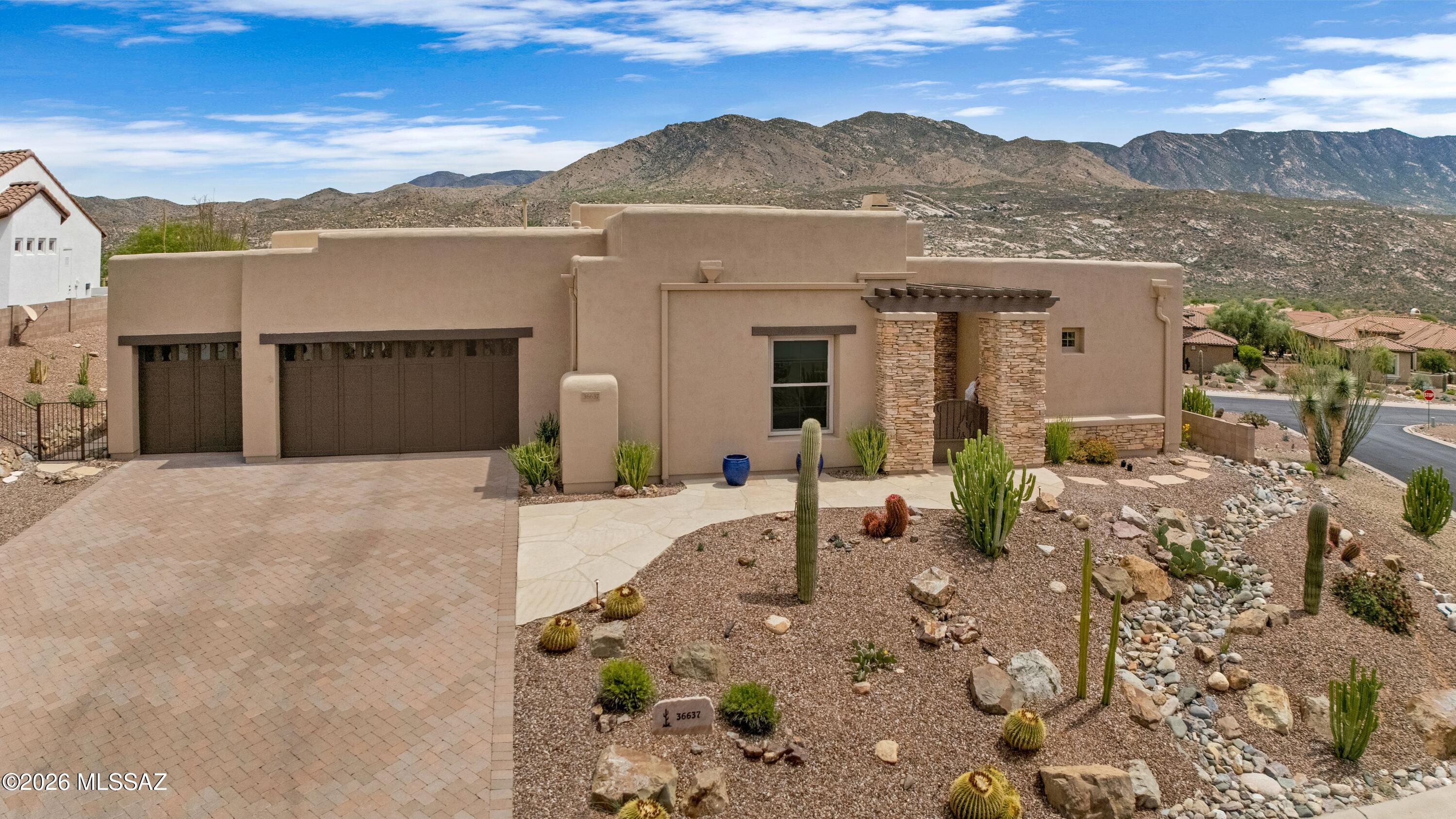 Exquisite Sonoran in the Preserve of SaddleBrooke on elevated corner lot with guest house & panoramic mountain views. Paver driveway, gated entry & courtyard. Elegant Great Room with gas fireplace & wall of sliders for indoor-outdoor living. Kitchen features granite counters, stainless appliances, gas cooktop, cherry cabinetry with slide-outs, island, nook, wet bar & butler's pantry. Den, dining room, & powder room. Spacious owner's suite offers dual vanities, 2 sided shower, jetted tub, & organized walk-in closet. Guest suite with closet & bath. Guest House has serving station, closet & bath. Laundry room with cabinets & sink. Extended 3-car garage has built-in cabinets. Covered patio with 2 electric rolling shades, built-in BBQ, & extended patios with capturing mountain views to enjoy!