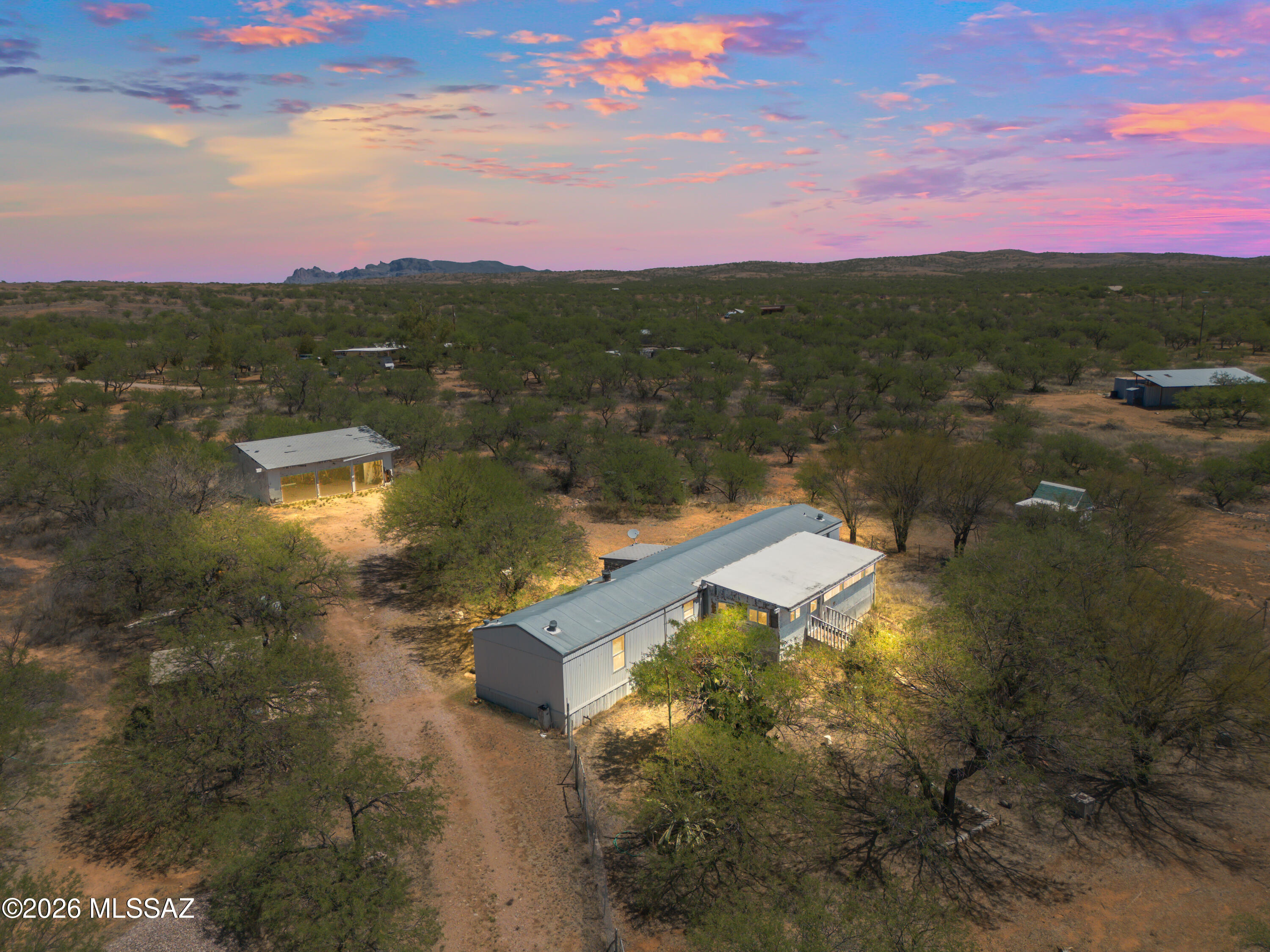 3 bedroom, 2 bathroom fixer upper on 2.5 acres with a private well! Located in the peace and quiet of Arivaca, this property offers the opportunity to add value from day one. There is a freestanding 3 bay garage/workshop on property along with other detached storage buildings. With no HOA, enjoy all the freedom of country living at a price that won't break the bank!

Cash only.

Square footage is approximate. Buyer to verify.