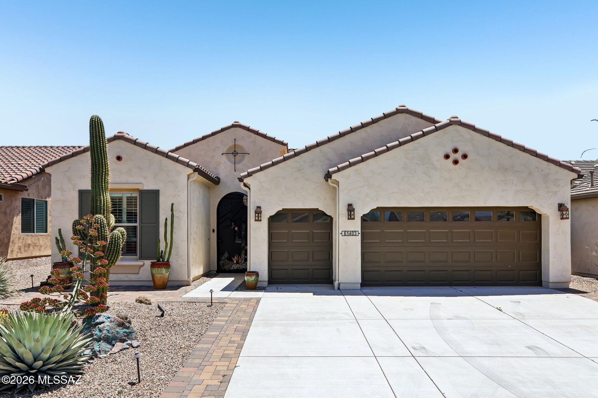 Mountain views. Open space behind. South-facing backyard. This Fresco floor plan in SaddleBrooke Ranch delivers the active adult lifestyle you've been waiting for. The great room opens to a retractable solar screen and sweeping Catalina views, while the kitchen offers granite countertops, a gas range, stainless appliances, walk-in pantry, and a breakfast bar island. Two bedrooms, two and a half baths, plus a den across 2,019 SF -- all neutral tile in main areas, carpet in bedrooms. The primary suite features a double vanity, spacious shower, and walk-in closet. Split guest layout for privacy. Extended 2.5-car garage fits two cars and a golf cart, with a utility sink and water treatment system. Native landscaping. Move-in ready.