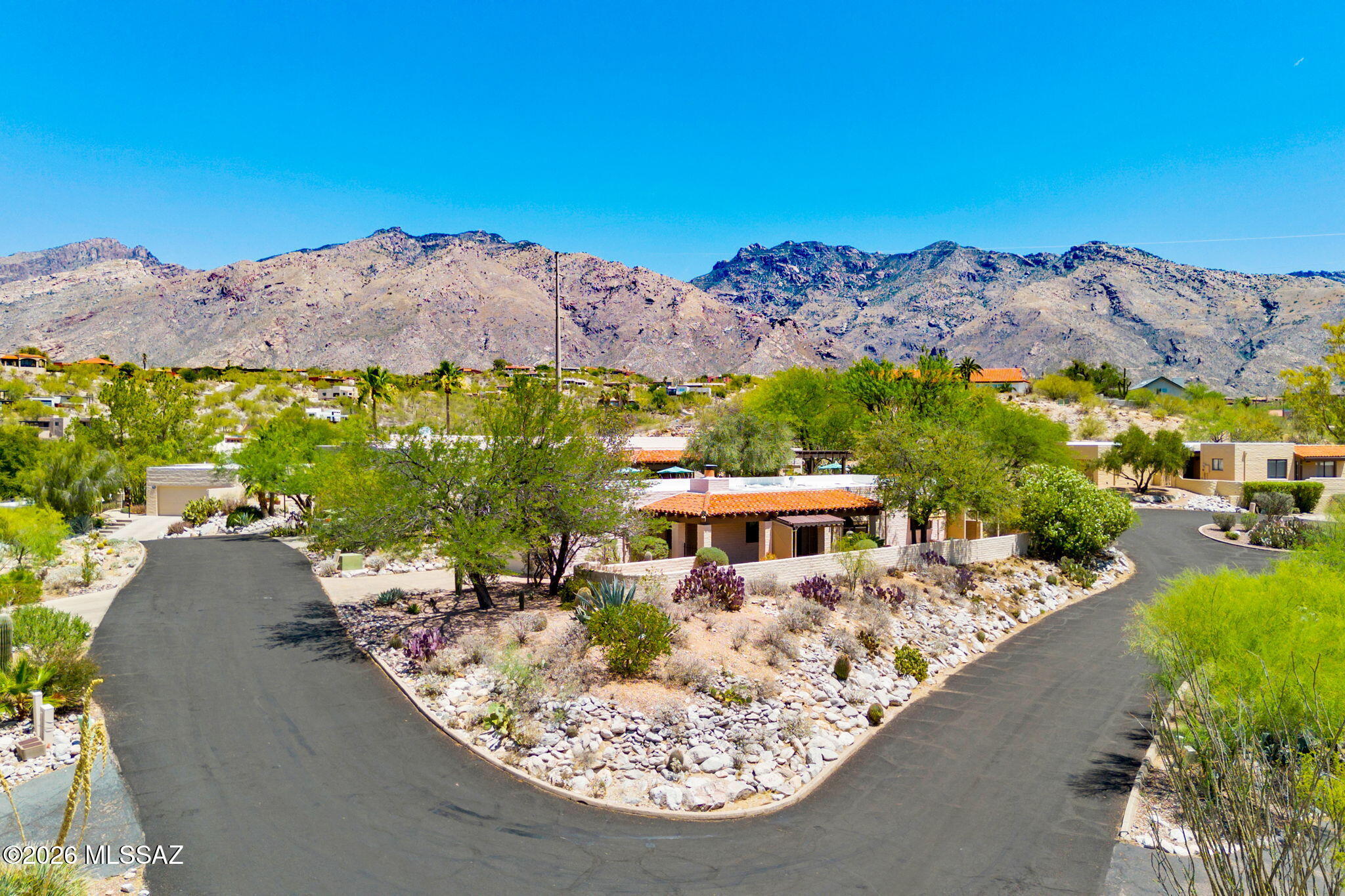 Southwestern charm and an indigenous feel are hallmarks of this classic Tucson home. Located in the Sunrise Presidio neighborhood, both community amenities and the lifestyle of Catalina Foothills are immediately accessible. Situated on an end lot in a cul-de-sac, this property lives easily like a townhome but does not have any shared walls (thus it is a single family). The generous outdoor space includes a spacious covered patio and open areas for seating with lovely SE & NE views of the city lights, hillside and mountains. Inside the home, you will find 1865 square feet with 2 bedrooms, 2 bathrooms and a den. The interior has been completely repainted for a fresh feeling space, complemented by beautiful, tiled floors. Recently the HVAC system has been replaced. The Sunrise Presidio neighborhood offers residents a community pool, tennis courts and lovely desert scenery. From this location, it's very easy to access hiking trails at Sabino Canyon, golf at Ventana Country Club, as well as ample options for shopping and dining. Access to Tucson Medical Center is easy as well, about 12 minutes.