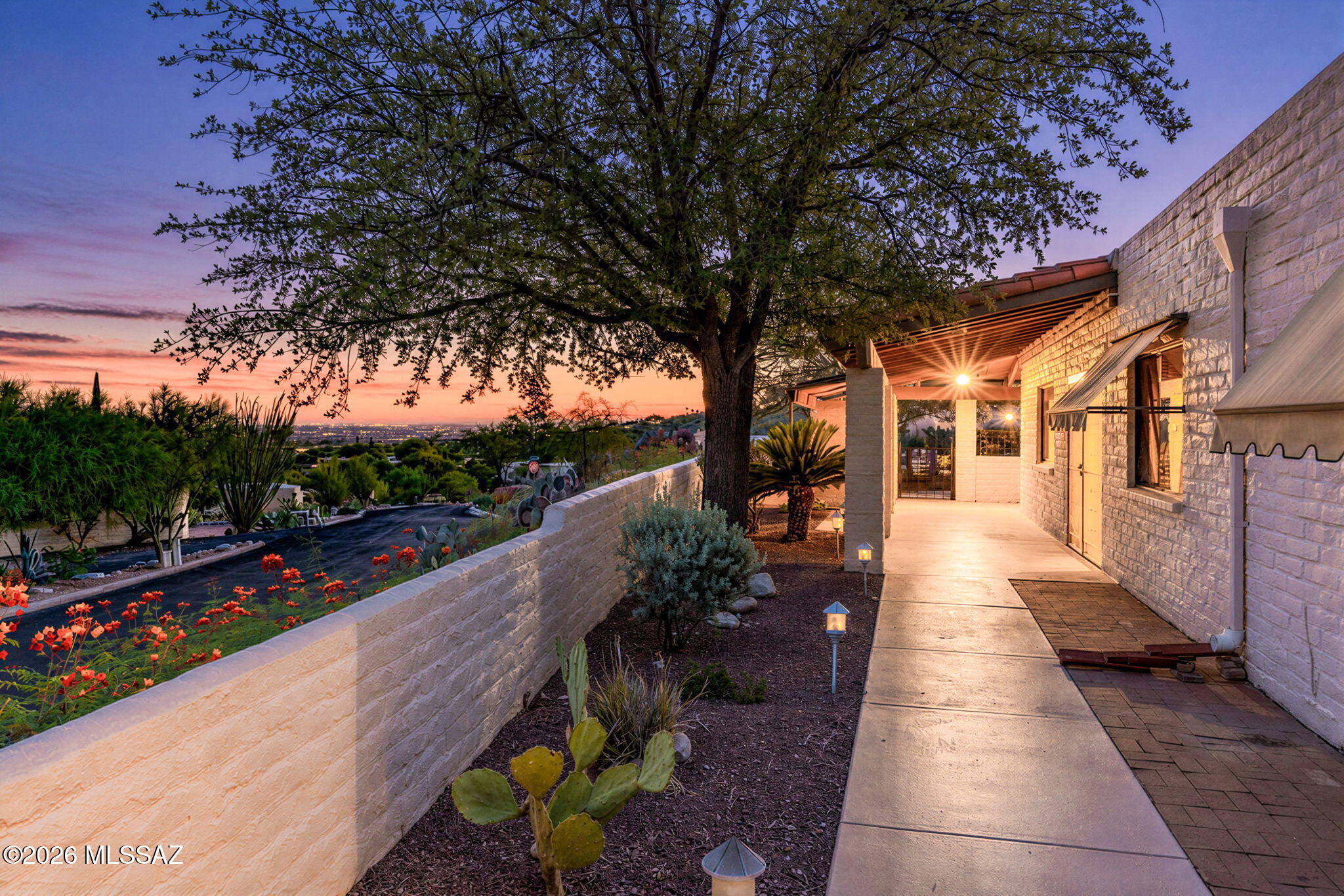 Southwestern charm and an indigenous feel are hallmarks of this classic Tucson home. Located in the Sunrise Presidio neighborhood, both community amenities and the lifestyle of Catalina Foothills are immediately accessible. Situated on an end lot in a cul-de-sac, this property lives easily like a townhome but does not have any shared walls (thus it is a single family). The generous outdoor space includes a spacious covered patio and open areas for seating with lovely SE & NE views of the city lights, hillside and mountains. Inside the home, you will find 1865 square feet with 2 bedrooms, 2 bathrooms and a den. The interior has been completely repainted for a fresh feeling space, complemented by beautiful, tiled floors. Recently the HVAC system has been replaced. The Sunrise Presidio neighborhood offers residents a community pool, tennis courts and lovely desert scenery. From this location, it's very easy to access hiking trails at Sabino Canyon, golf at Ventana Country Club, as well as ample options for shopping and dining. Access to Tucson Medical Center is easy as well, about 12 minutes.