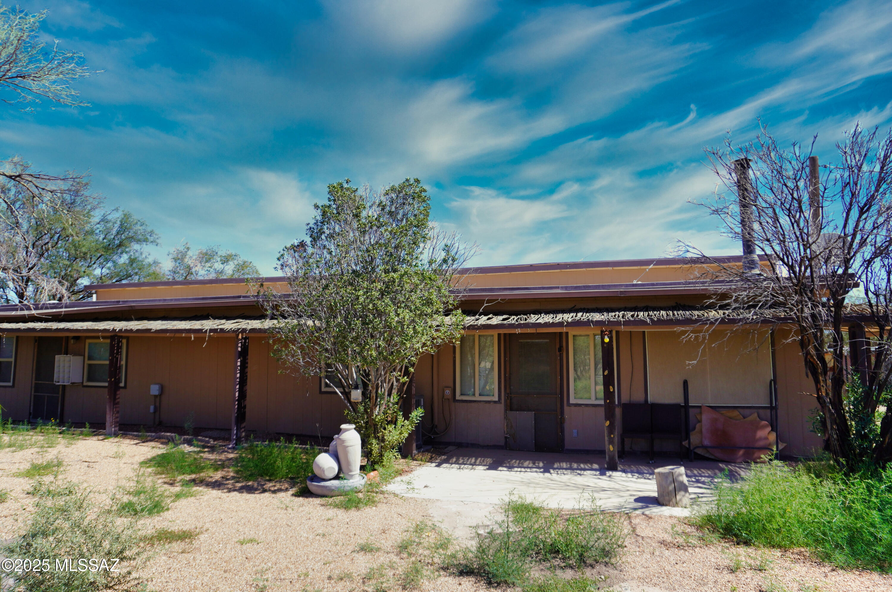 Bring your horses and farm animals to this 10 acre property with lots of privacy, good/easy access not too far off Hwy 191. Zoned RU4. No Restrictions. NO HOA. Property also includes a 2 bedroom guest house. 2 fireplaces. 3 bedrooms in the main house and 2 in the guest house. Each bedroom in the main house has its own bathroom for 3 master bedroom suites. Kitchen has stainless appliances, large dining area plus a breakfast bar. In the main house, there are 2 living rooms, one with a fireplace. The guest house has a cozy wood burning fireplace, full kitchen, laundry, Living room, full bath, storage loft plus 2 bedrooms. MFH is a 1982' with additions. The guest house built in 2005'. There is a nice tack/hay building. Chicken house/pens. 
Lots to offer on this 10 Acre Ranch! Cash only sale.