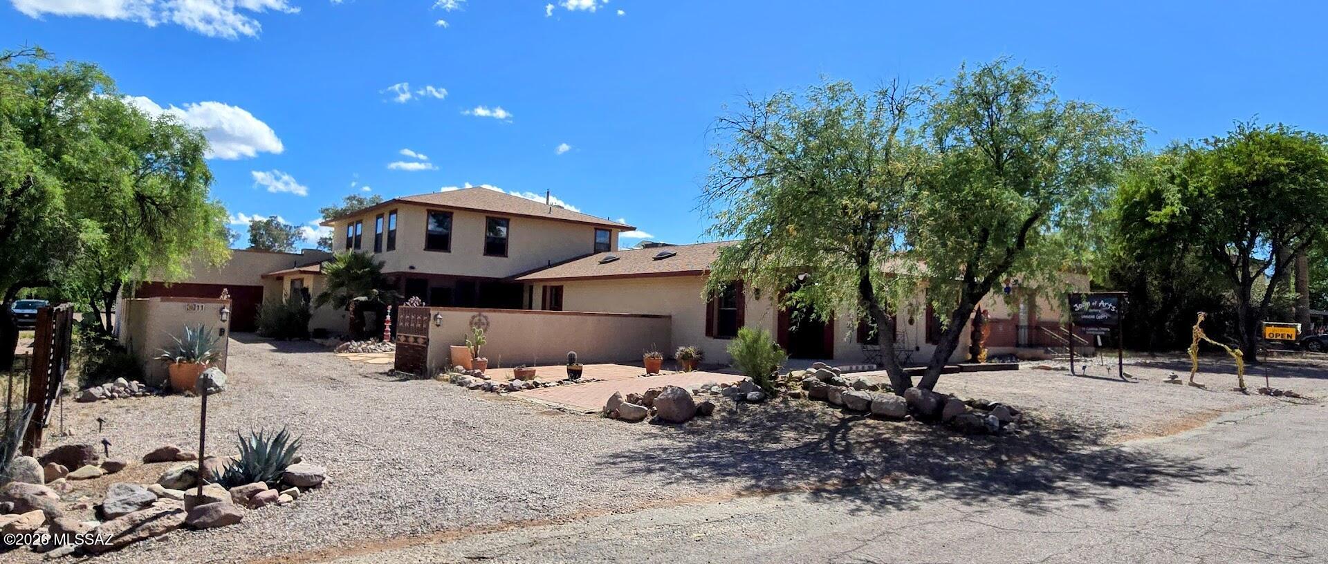 Quality versatile commercial building with an excellent residential component in the Tubac Village. It starts with a large Gallery/Retail space right on Camino Otero with public parking spaces. Then a large comfortable and spacious 3 bedroom, 2 full bath, home with large private courtyard and double garage. The home has recently been remodeled with all new flooring, wall treatments, lighting, fireplace, and new plumbing throughout. It boasts a chef's kitchen with all new quality appliances, cabinets, counters and a large island. Then, an extra large shop space to create most anything, with high ceilings, double doors, skylights, natural gas and plenty of power. And another rentable space. Two half baths within the rental spaces.  All of the commercial rental spaces can be broken up into additional rentals. The current configuration has a separate access for each different tenant, commercial or residential. Incredible leasing opportunities exist or can be used as a live / work space that has it all. A must see.  Great opportunity for an investor as well.