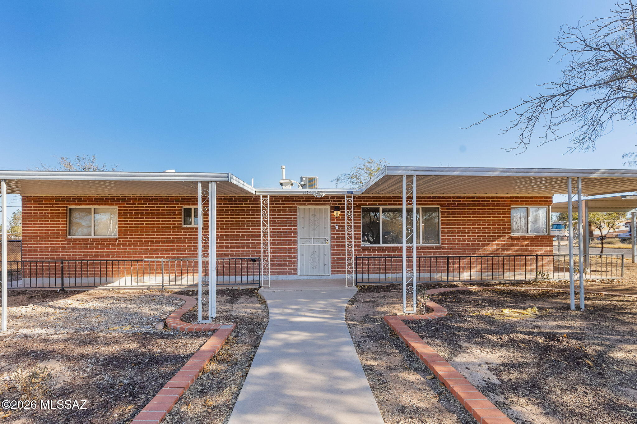Charming Mid-Century Home with room for 2nd ADU Dwelling or Mother in Law Suite / office in large oversized back yard!
Modern Upgrades in Prime Tucson Location Experience the perfect fusion of classic elegance and contemporary comfort in this well-kept single-family home, built in 1963, on a spacious corner lot in midtown Tucson.  Key Features: No HOA:Close to DMAFB, parks, schools, dining, shopping, and public transport. Just 5 miles southeast of downtown Tucson, the University of Arizona, and Pima College. Quick access to I-10 and I-19 for effortless commuting. Recent Upgrades: New AC/Heater unit installed in 2022. New roof with a 10-year warranty, valid until October 2033. electrical panel.
Renovated bathrooms with a modern touch.
Exterior Highlights: Fully fenced yard with three gates for security and convenience.
Spacious asphalt driveway with two covered steel parking areas.
Expansive 33x13'4 patio with washer and dryer hookups ideal for relaxation or entertaining. Paved walkways and accessible sidewalks for ease of movement.
Large awnings for shade and mature mesquite trees in the backyard, perfect for expansion or play.
Interior Features: Elegant Italian tile flooring throughout the living areas and utility space. Stylish wood tile in all three bedrooms.
Fresh ceiling fans in key areas for added comfort.
Beautiful maple kitchen cabinets and an extra utility room with an additional sink. Smoke-free environment for clean, fresh air.
This lovingly maintained home is ready for its new owners. Don't miss the chance to own this gem in a sought-after location!