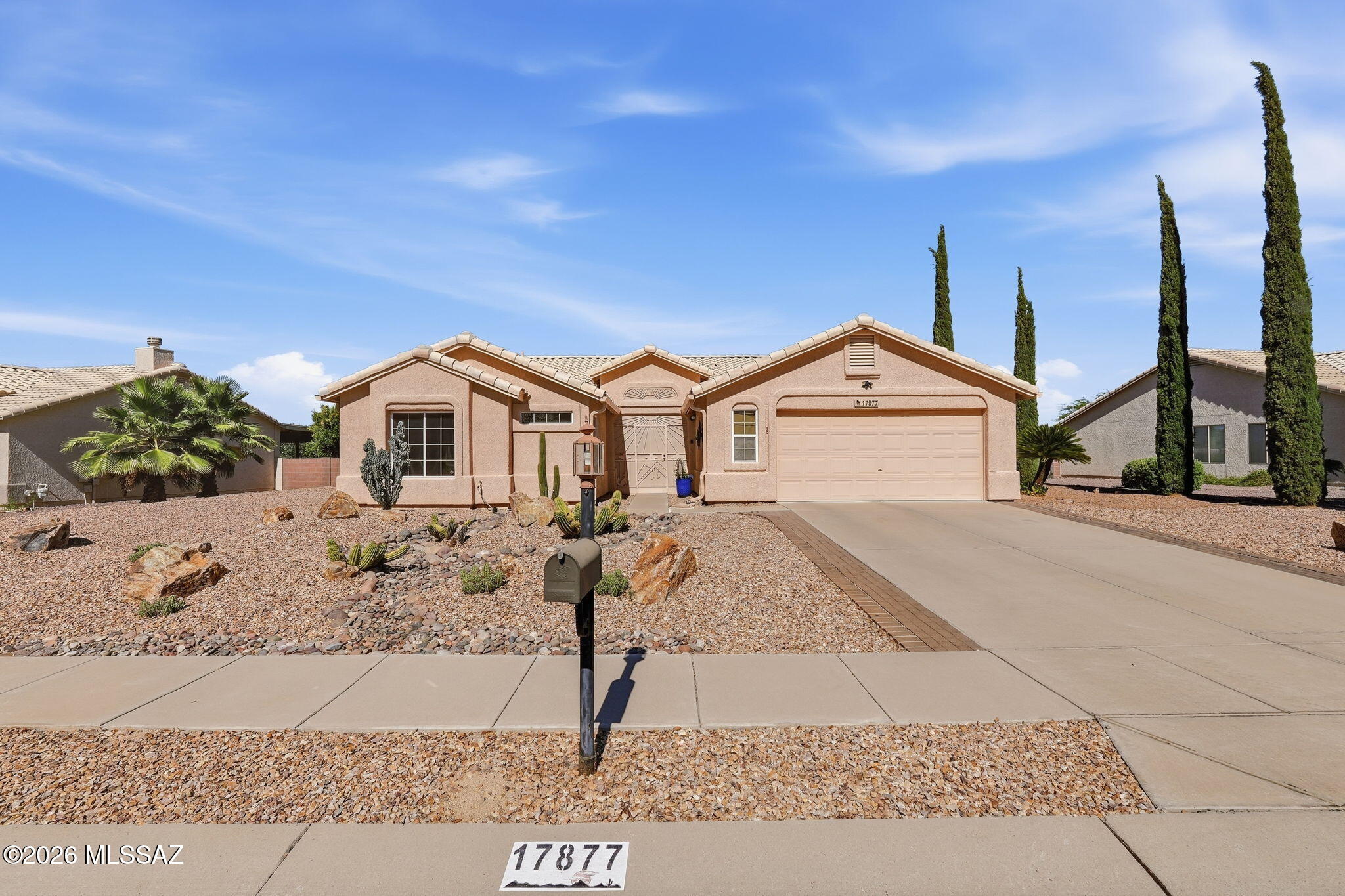 Set on an oversized lot, this beautifully maintained Sahuarita home offers comfort, privacy, and natural feeling outdoor space. This 3-bedroom, 2-bath home is located in the quiet, family-friendly Los Colinas community. Inside, the split floor plan, cathedral ceilings, and fully enclosed Arizona room provide a generously spacious living space. The expansive backyard features several fruit trees offering shade and privacy, while still providing gorgeous mountain views. Recent updates include a new roof, HVAC system, and reverse osmosis system, all installed within the past few years. The home also comes equipped with a washer, dryer, refrigerator, dishwasher, and electric range stove.