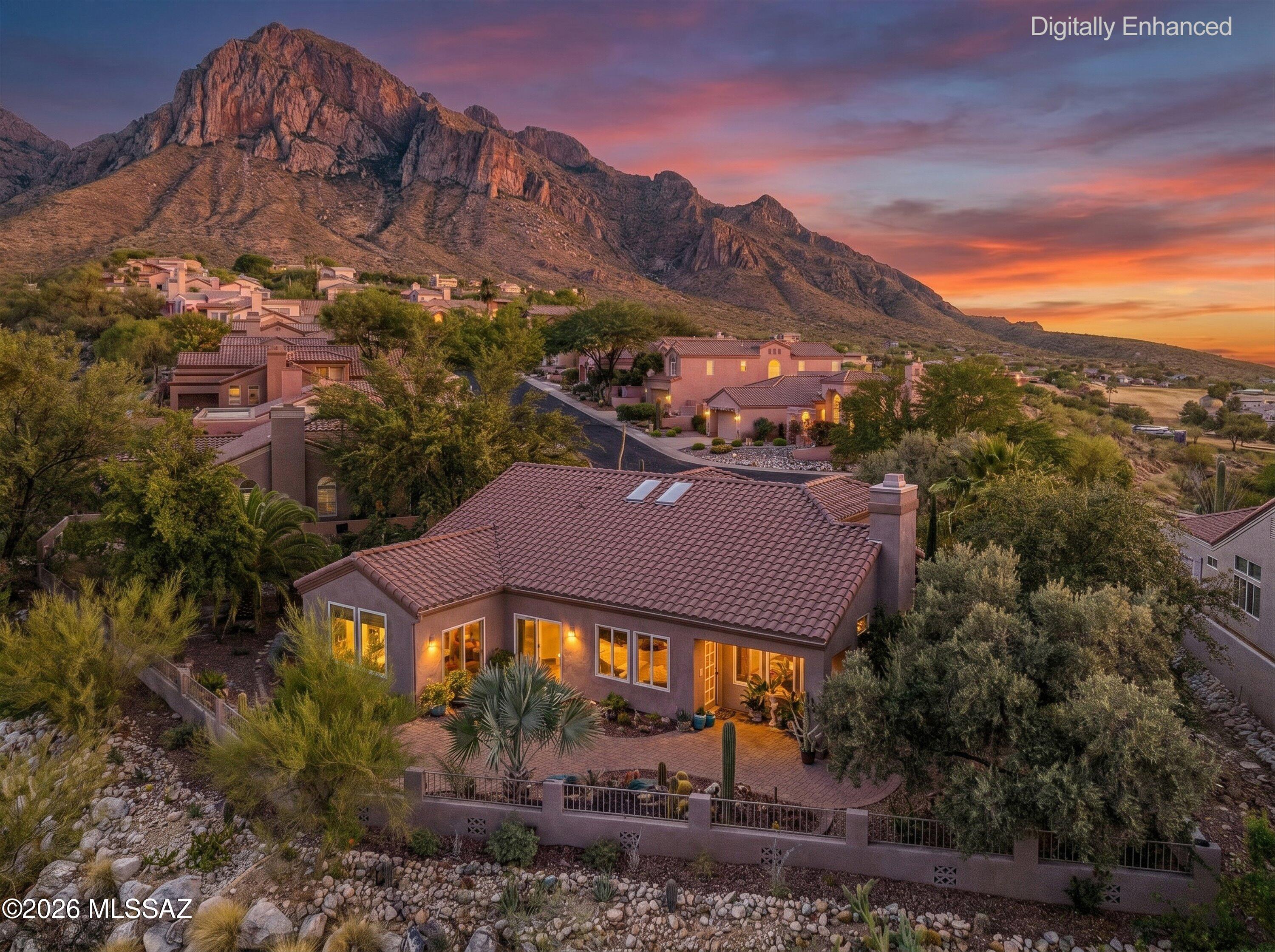 Highly sought-after gated community of The Ridge at La Reserve, this meticulously maintained original-owner home is situated on an oversized premium lot, offering exceptional privacy along with breathtaking mountain and sunset views. Spanning 2,184 square feet, the thoughtfully designed single-level floor plan features 3 spacious bedrooms, 3 beautifully updated bathrooms, and a dedicated laundry room. The upgraded kitchen is a chef's delight, showcasing custom cabinetry, granite countertops, a full tile backsplash, and double ovens--perfect for entertaining and everyday living. Rich Saltillo tile flooring flows throughout the home, adding warmth and timeless Southwestern charm. Abundant natural light pours through high-quality Anderson windows and doors. Home and Roof inspection completed. A newer HVAC system installed in 2020 provides peace of mind and energy efficiency. Designed for comfortable living and effortless entertaining, the home's seamless layout offers versatile spaces that blend functionality with style. Enjoy the tranquility of your private setting while taking in the stunning desert landscape, mountain vistas, and unforgettable Arizona sunsets from this exceptional La Reserve retreat. Home located in cul de sac.