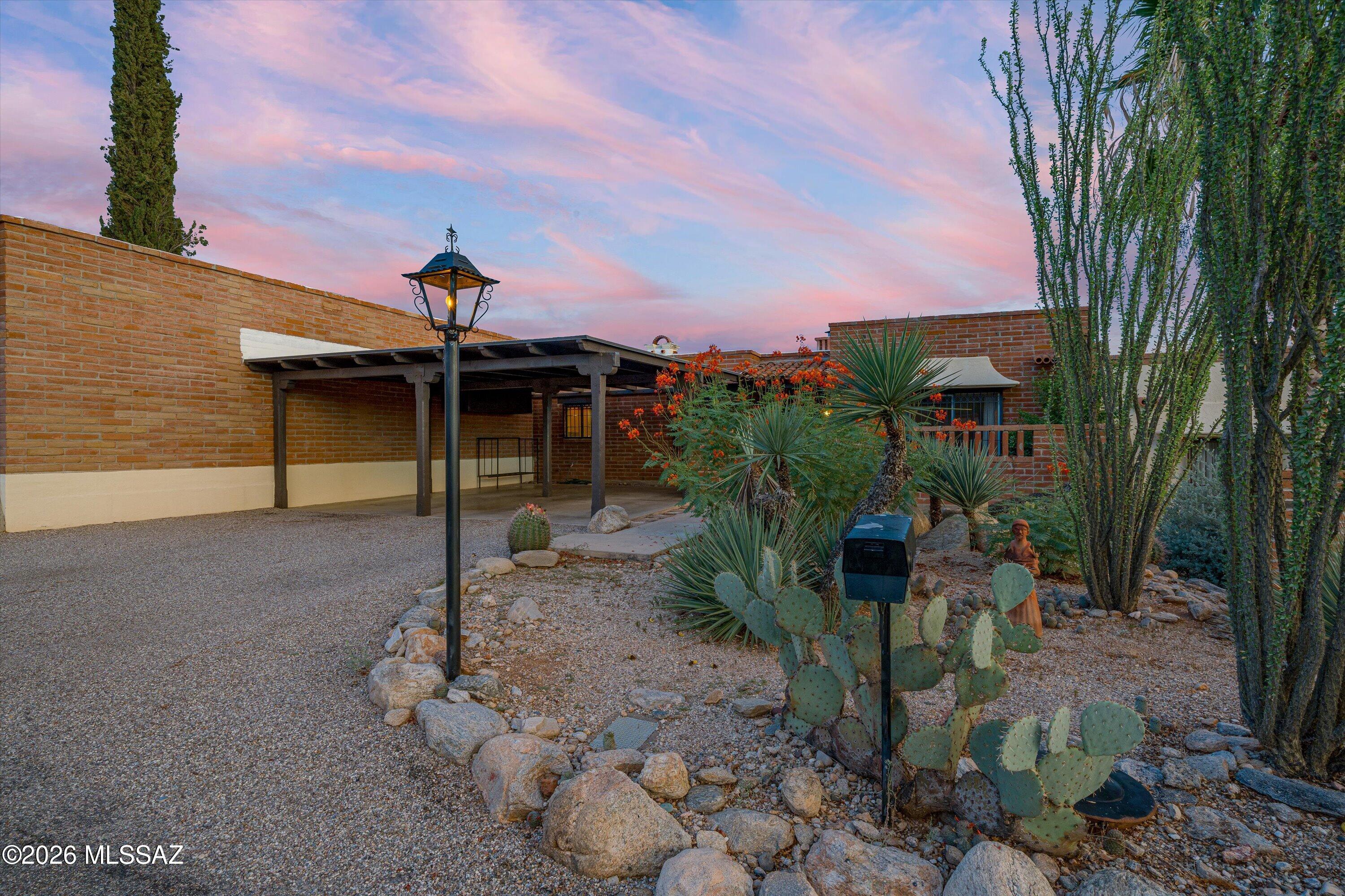 BELOW APPRAISED VALUE! Rare opportunity awaits in the heart of the Catalina Foothills! This is your chance to own a classic Tucson burnt adobe territorial townhome in the Catalina Pueblo community; just a short walk to both the Plaza Colonial and La Encantada shopping corridors. This location can't be beat! Enter through the charming courtyard, and inside you will find updated concrete flooring throughout, and a thoughtful 2 bed/2 bath floorplan that creates large living within a smaller footprint. Both bathrooms have been updated, along with the galley kitchen which includes all appliances. This well-loved home boasts a private and lush rear yard that includes a spiral staircase to spectacular views! There is also a gate and a short walk leads to one of three community pools.