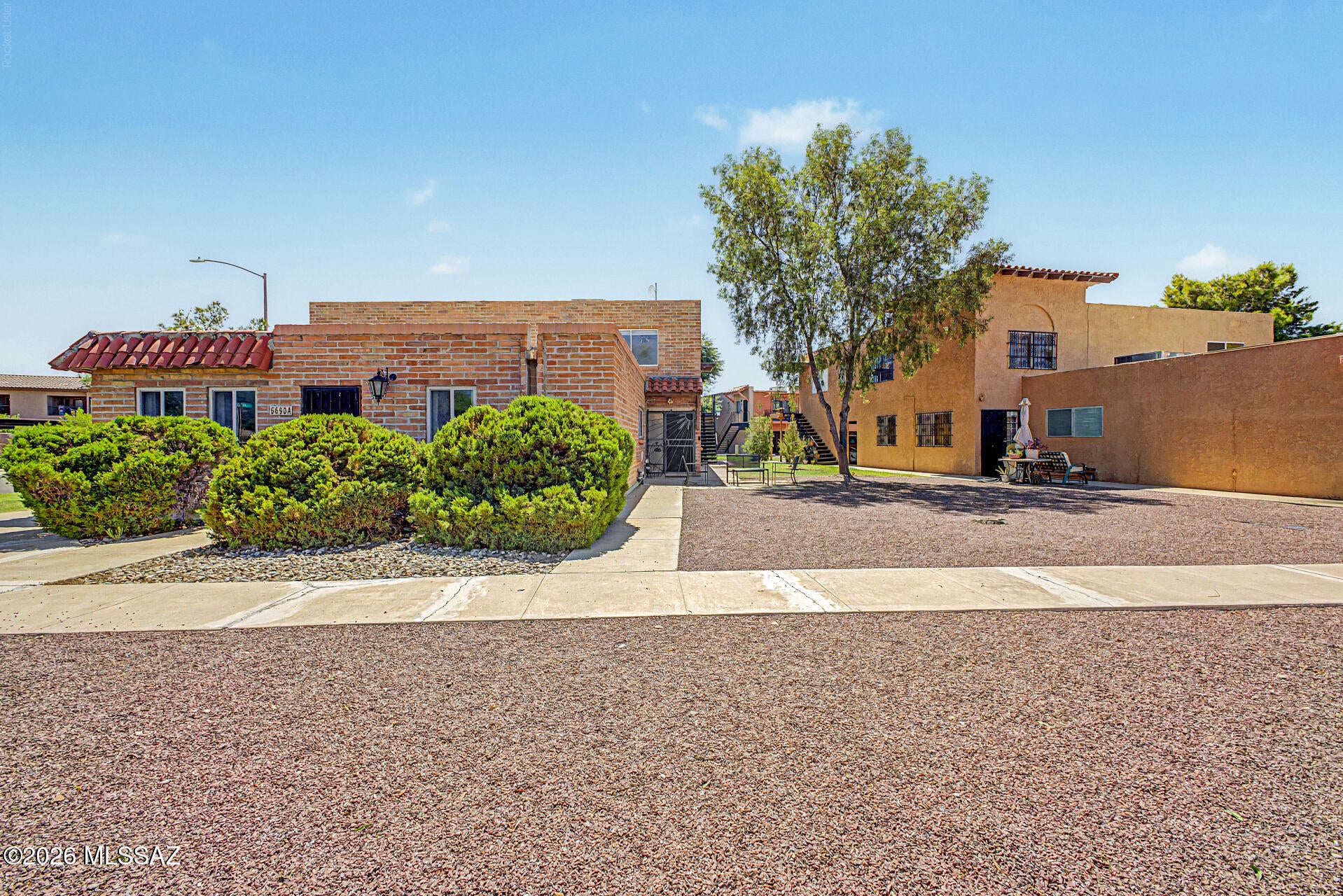 Enjoy low-maintenance living in this lovey two-story townhome surrounded by the lush grounds of The Meadows. The updated kitchen offers granite surfaces, modern cabinetry, and casual bar seating, while rare in-unit washer/dryer hook-ups add extra everyday convenience. Upstairs are two generously sized bedrooms and a full bath. Residents enjoy two gated pools and easy access to dining, shopping, schools, and transportation. HOA covers water, sewer, trash, roof/exterior maintenance, pools, and common areas. A MUST SEE!