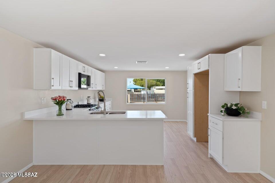 Completely reimagined and move in ready, this beautifully renovated modular home in vibrant Tucson offers modern style without the modern price tag. Every detail has been thoughtfully updated - from fresh interior finishes to upgraded flooring, fixtures and a stunning new kitchen designed for function and flair. Light filled living spaces create an inviting atmosphere, while refreshed bedrooms and bathrooms provide comfort and contemporary appeal. Whether you are a first-time buyer, or seasoned resident or savvy investor, this turn-key property delivers exceptional value on one of Southern Arizona's most exciting and growin 55+ communities!