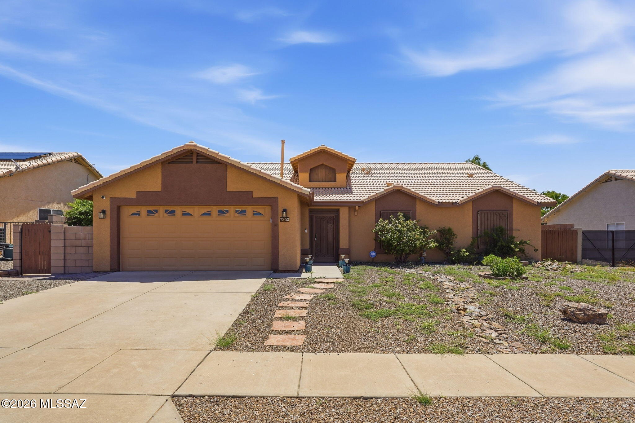 NO HOA, RV gate & Solar!
Come and see this beautifully maintained, single-story residence located in the desirable Rita Ranch neighborhood. This spacious 4-bedroom, 2-bathroom home features an inviting and spacious floor plan with tile flooring, carpet in the bedrooms, and a cozy fireplace in the living room. Surround sound speakers place audio all around you!
The kitchen is a standout, equipped with newer sleek stainless steel appliances, granite countertops and maple cabinets.
Step outside to trees, grass and flagstone throughout the backyard perfect for relaxing or entertaining.  
Enjoy extra storage with 2 new TUFF sheds and bring all your toys through the RV gate.
Security alarm system and cameras on site and ready for you to connect.
Enjoy saving on electricity with the solar p