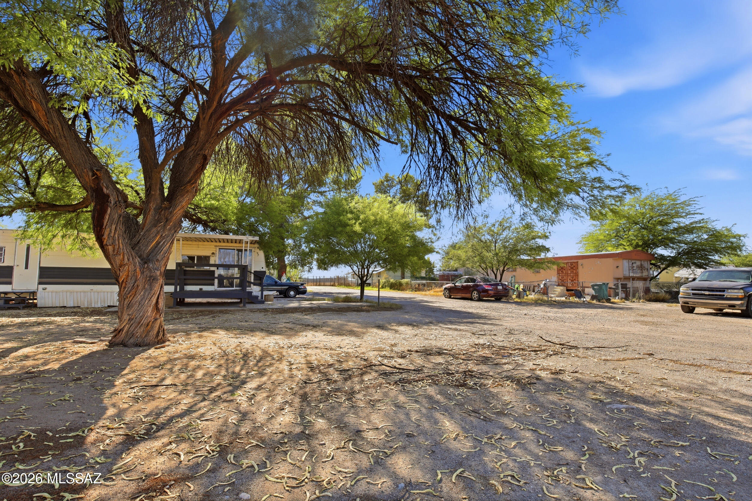 Opportunity awaits on this 1.04-acre property featuring three tenant-occupied manufactured homes and endless potential for future growth. With a total of five spaces, this property offers immediate rental income while leaving room to maximize its possibilities. Mature trees provide shade and character, while ample parking adds convenience for tenants and guests alike.