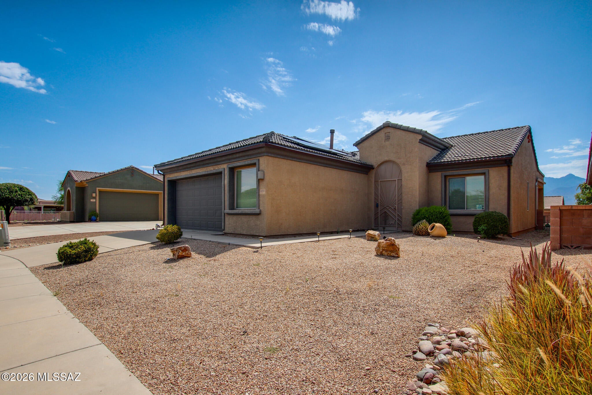This inviting home features a spacious great-room floor plan with mountain views and an abundance of natural light. The kitchen offers raised-panel oak cabinetry and recessed lighting, while the dining/flex room provides versatile space for entertaining, dining, or a home office. Security screen doors at both the front and rear provide added comfort and convenience. The garage is thoughtfully equipped with overhead storage and a dedicated workshop area. Major updates include a roof replaced in 2023, owned solar, a newer refrigerator, and a newer water heater. Furniture and furnishings are also available for purchase under a separate bill of sale, offering a convenient opportunity for a turnkey transition. Desirable gated community!