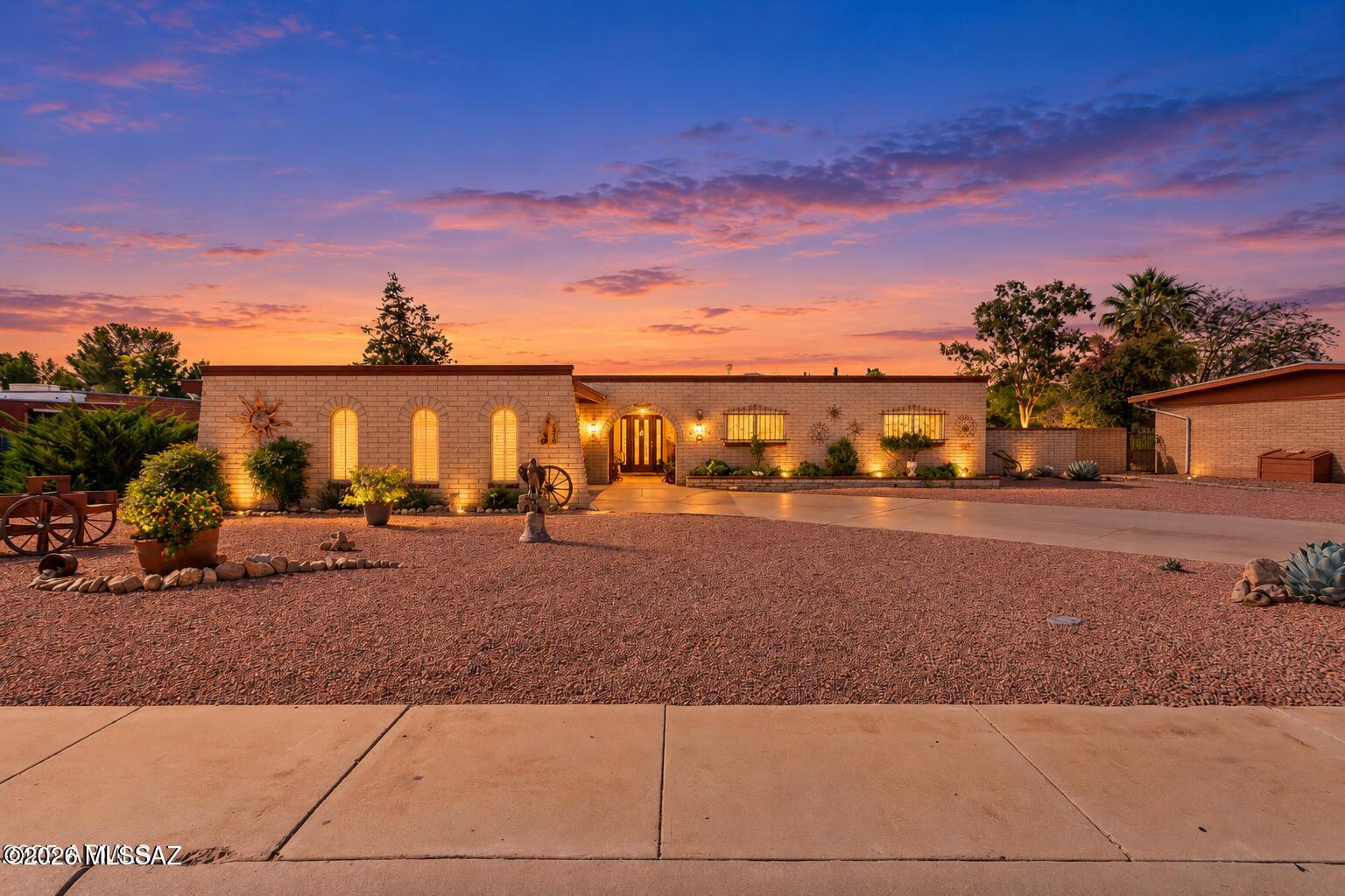 Every inch of this move-in ready charmer radiates warmth, creativity & perfection. Thoughtfully reimagined & beautifully updated w/ new
dual-pane windows, flooring, floorplan redesign & designer finishes, it's the perfect blend of classic charm & modern comfort. The rare 400 sq. ft. detached
guest house offers endless possibilities. Ideal for guests, a studio, or private retreat (no water to GH).  690 SQFT Arizona room, extending the living space the full length of
the home. Crafted for year-round enjoyment & effortless indoor-outdoor living. The manicured landscape & gated courtyard create a lush welcome, complete w/ a ready-to-plant garden area to nurture your inner green thumb & grow your dream harvest, timed irrigation front & back, motion activated security lighting. SEE SUPPLIMENT Inside is irresistible w/ warm, open & inviting spaces. The kitchen delivers true "wow" factor with spacious cabinetry, generous counters, & plenty of room for gatherings or culinary adventures.   Extended length main bathroom vanity & dual sinks at guest bathroom.  All this on a beautiful, stroll worthy, mature street w/ sidewalks & streetlights, w/ no HOA, space for RV, toy, or trailer parking behind the home, & of course, panoramic Huachuca Mountain Views. "Stop the car" curb appeal. Absolutely beautifully maintained. You asked, & this home delivers. Perfection meets charm.

Guest house or studio is detached can & be used as a studio, office or multipurpose room with wall AC/heater. No water or sewer.