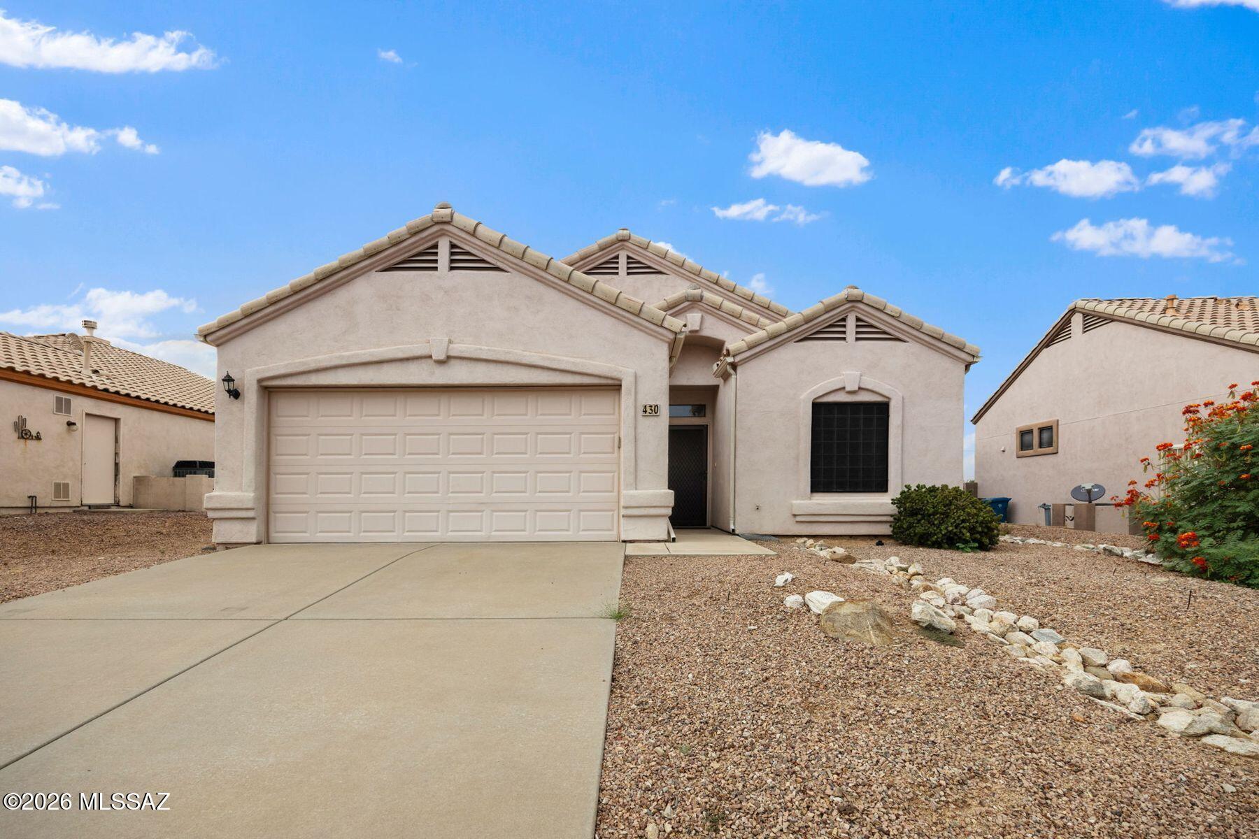 This 1,641 sq ft Green Valley home offers 2 bedrooms, 2 baths, an open floor plan, abundant natural light, and no carpet. The great room features a gas fireplace and connects seamlessly to the dining area and kitchen, complete with a large island, breakfast bar, pantry, and breakfast nook. The spacious primary suite includes a soaking tub, separate shower, dual vanities, and walk-in closet, while the oversized second bedroom features double doors and direct access to the guest bath. Outside, the low-maintenance backyard features an extended brick patio, covered patio, mature landscaping, and mountain views. The 2-car garage includes overhead storage for added convenience.