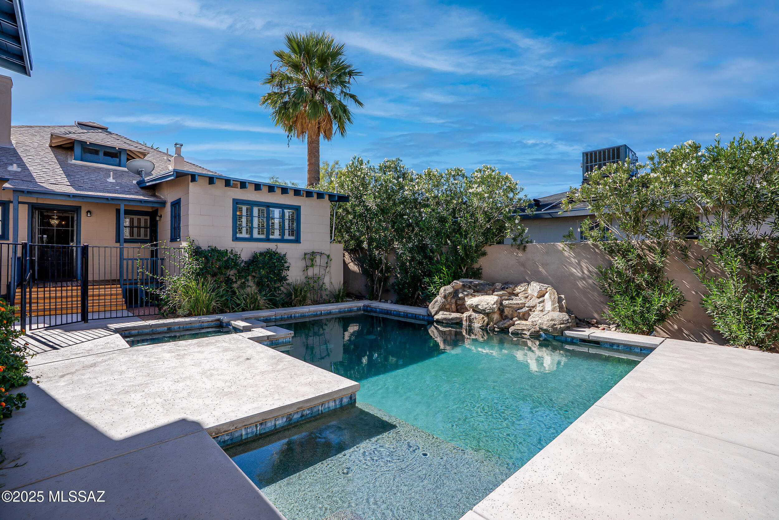 Opportunities like this don't come around often! Set on a coveted corner lot in West University, this exceptional 1899 property offers a one-of-a-kind blend of charm, privacy, and income potential, all just minutes away from Tucson's most beloved shops, restaurants, and the university.
The main residence features a welcoming wrap-around porch, 4 spacious bedrooms, 3 bathrooms and a two car garage. A thoughtfully designed remodel highlights the heart of the home: a chef's kitchen quartz countertops, custom cabinetry, walk-in pantry, and a large island perfect for hosting. 
Beyond the main house, a separate 1-bed/1-bath guest house provides flexible space for visitors or extended family, while a detached duplex, each side offering 2 bedrooms and 1 bath, adds incredible rental income to offset your mortgage.
Outdoors, the property transforms into a true oasis: lush landscaping, sparkling pool and spa, multiple covered patios, outdoor fireplace (original Franklin stove from kitchen) , and fully enclosed privacy walls create the perfect backdrop for morning coffee or evening gatherings. The rare 2-car garage offers ample space for vehicles, storage, or gear.
Whether you're searching for a private retreat, a multi-generational setup, or an investment with proven returns, this West University treasure delivers it all. Includes addresses 811,815,819 N 5th Ave. Tenant occupied- do not disturb tenant