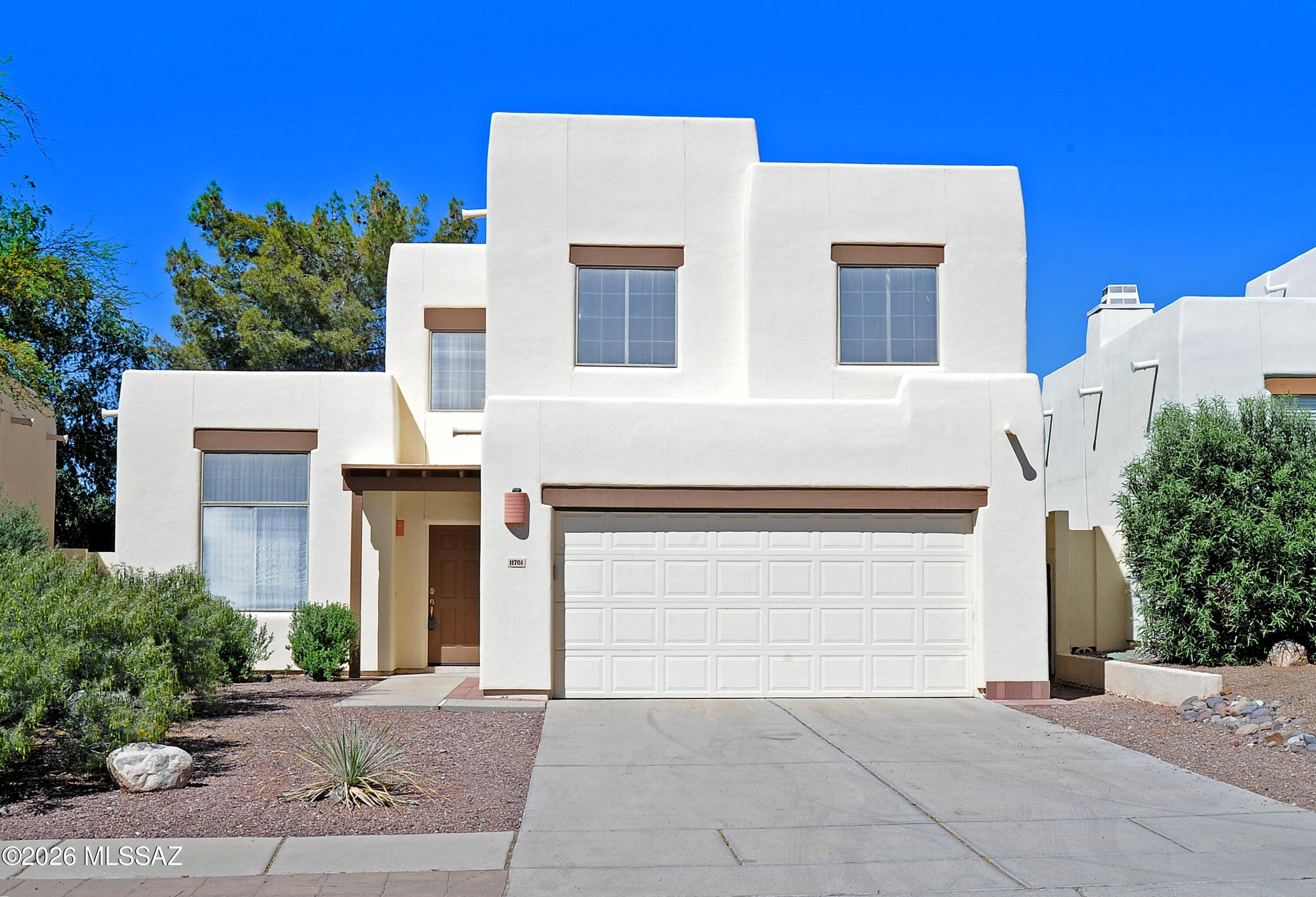 Welcome to this beautifully maintained 4 bedroom/ 2.5 bath home nestled in a sought after, well established NW neighborhood w/ incredible vistas of the backside of the Catalina Mtn range!  This property is surrounded by mature trees in the backyard, affording plenty of shade & privacy for entertaining!   Step inside to discover a spacious & inviting layout designed for both everyday living & entertaining.  Large windows throughout the home showcase breathtaking Mtn views! The well appointed kitchen flows nicely to the family gathering room & formal dining area.  Upstairs find peace & quiet with the Primary suite and 3 additional bedrooms w/ incredible Mtn views!  Wonderful neighborhood, close to  shopping/ dining & many convenient amenities!