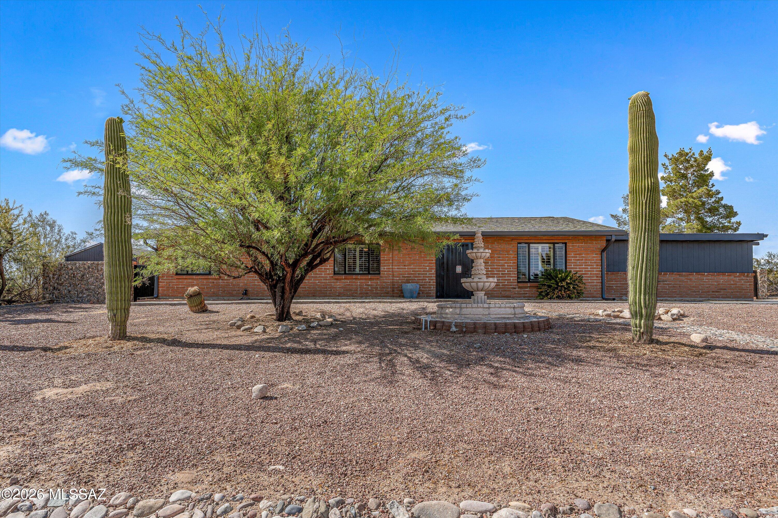 NO HOA! Desert luxury, redefined. This stunning retreat sits on a private 1-acre lot with NO HOA, blending modern elegance with effortless Southwest style. Sunlit interiors reveal a sleek, fully remodeled kitchen with granite countertops, graphite-finish appliances, and a chic beverage station. The open living space, anchored by a cozy fireplace, flows seamlessly to a resort-style backyard featuring a sparkling saltwater pool, covered cantina bar, and scenic desert landscaping. A spa-inspired primary suite with soaking tub and wet-room shower, plus guest quarters and a bonus space, complete this private escape--just minutes from the best of town. W/D/Fridge/TVs Included!! ''See More'' for Mechanical Improvement list. OTHER MAJOR IMPROVEMENTS INCLUDE: FRESH PAINT, NEW CARPET, Roof (2018), SEPTIC REPLACE/UPGRADE (2016), HVAC, HVAC DUCT SEALING & NEW WATER HEATER (2020), POOL REPLASTER/SALT SYSTEM/KOOL DECK. HALLWAY BATHROOM REMODELED (4/2023), MASTER BATHROOM REMODELED (7/2024). A MUST SEE!