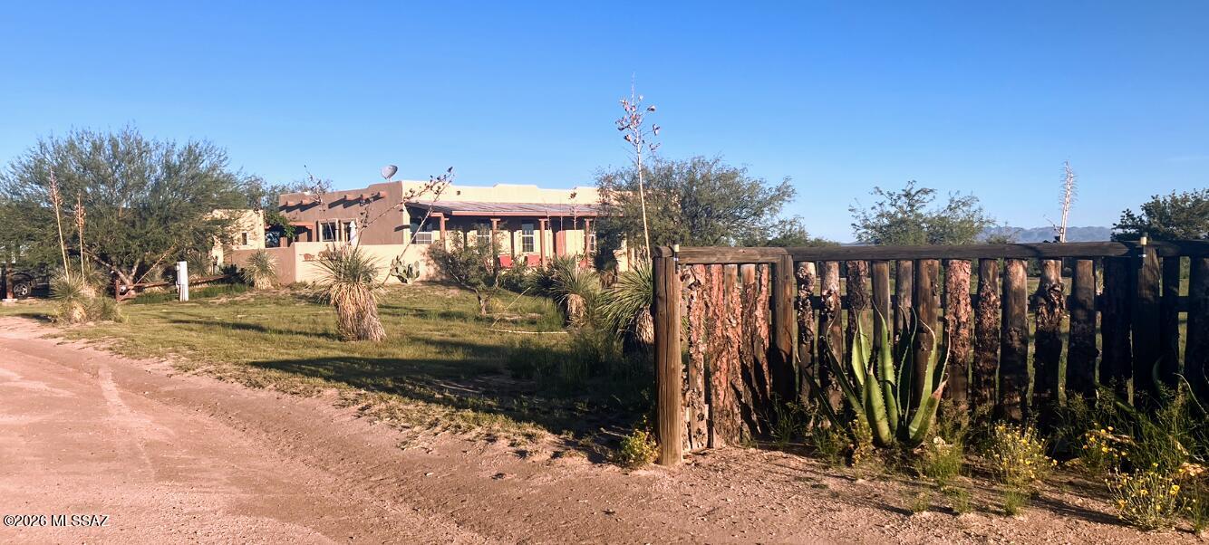 Pride of ownership shines throughout this 10 acre horse property . The property features a 150×280 working roping arena, training arena, eight covered stalls, hay storage with large tack room &shade cover. Two complete RV hookups  for visitors. Fenced & crossed fenced. Access to State Land for riding.   
The 2007 upgraded Santa Fe-style ground set MFH / 3 bedrm, 2 full baths, tiled floors. The inviting layout includes a formal dining area and an office/den with outside entry from courtyard to the master suite and or Kitchen. A second exterior entrance leads into the laundry/mudroom for practical everyday use. Enjoy outdoor living with large covered back porch patio with access to two car carport & workshop/ storage 
 A rare combo of turnkey horse amenities and comfortable country living