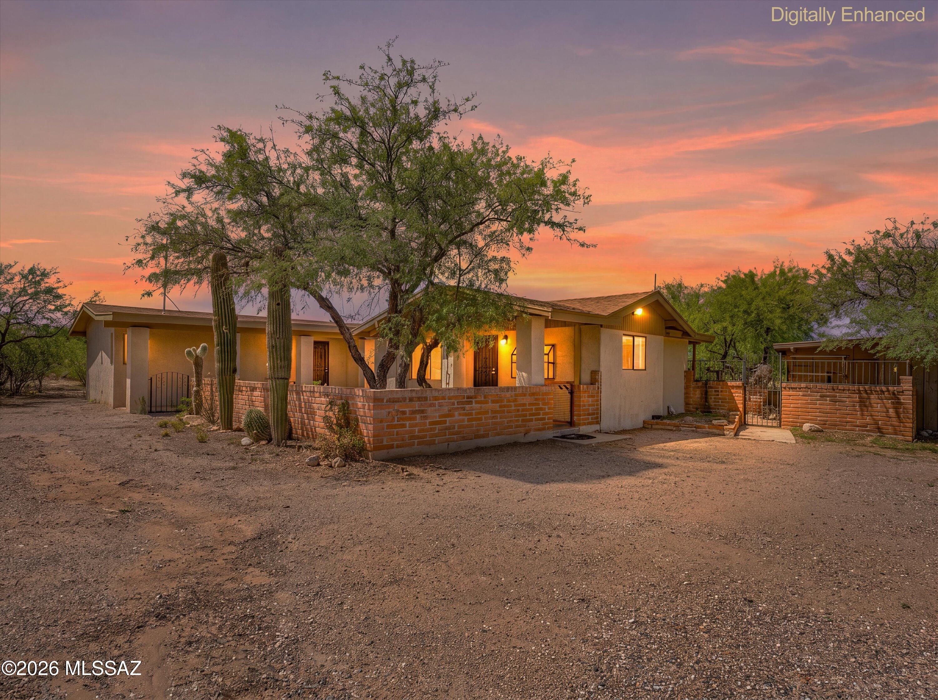 Looking for room to spread out without giving up convenience? This nicely maintained home sits on a spacious 1-acre lot with breathtaking views of the Santa Rita Mountains and incredible Arizona sunsets. The property is fully fenced and features mature shade trees, a shade cover/barn building, and a separate tack room that can easily be configured into two horse stalls. With neighboring properties already set up for horses, it's the perfect opportunity to bring your horses and enjoy the equestrian lifestyle.

Inside, you'll find a bright, open floor plan with vaulted ceilings, an updated kitchen featuring warm wood cabinetry and stainless steel appliances, spacious bedrooms, and comfortable living spaces that are move-in ready. Major updates include a new roof and water heater installed in 2020, plus the added bonus of Vail water.

Whether you're looking for space for horses, RVs, toys, gardening, or simply a little more room to enjoy the peaceful desert surroundings, this property offers endless possibilities.

Cash buyers welcome, and seller carry financing may be available with acceptable terms, making this a rare opportunity for buyers seeking flexible financing options.

Properties offering this much land, mountain views, and flexibility don't come along often--don't miss your chance to make it yours!