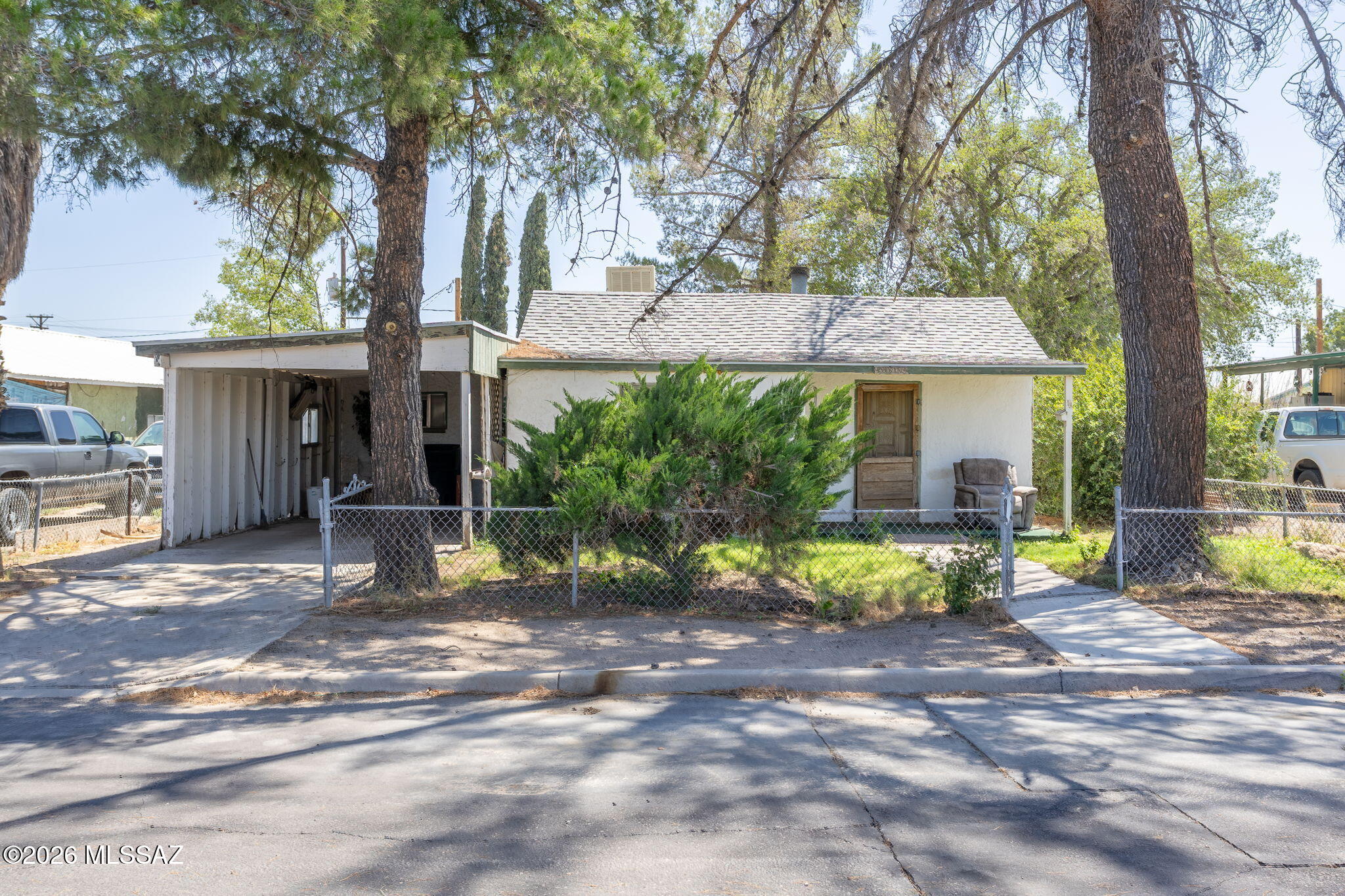 2-bedroom, 1-bath home offering 1,074 sq. ft. of living space on approximately 0.14 acres. The layout includes a kitchen, dining area, and living room, with two bedrooms and a full bathroom. Flooring throughout the home is carpeted, and the interior offers a practical footprint with potential for updates and customization.

Outside, the property includes a 1-car attached garage and a manageable yard. A major plumbing improvement has already been completed with a newer main water line from the city to the home. The property also features a newer furnace and swamp cooler. The roof is approximately 10 years old. New windows and cosmetic interior updates are needed, creating an opportunity to add value and finish the home to your preferences.
