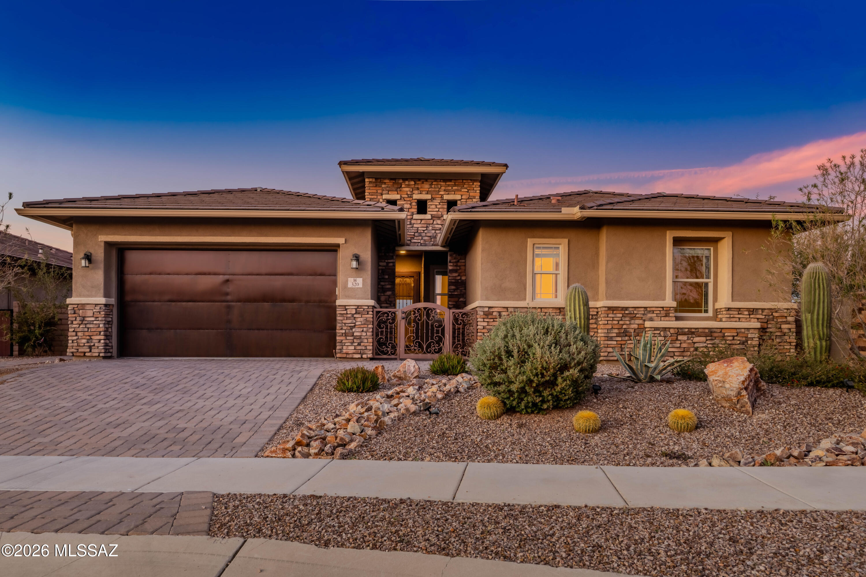 Assumable Loan for VA or non VA Buyers @ 3% w/a principle balance of $350K is available with this contemporary style 3 BD 3 BA home with 2 bonus rooms situated on an ''oversized'' corner lot with southern exposure, un-restricted views of the Catalina and Tortolita Mountains backing to the ''Vistoso Trails Nature Preserve'' in the highly sought after peaceful gated community of Rancho Vistoso Highlands in Oro Valley. This gorgeous home is pristine and ''like new''
with 3-4 bedrooms, 2.5 Baths, Gourmet Kitchen, Den, ''Teen room'' or ''Man Cave'', oversized 2 Car Garage with Epoxy Floors. Exterior features include  a wonderful Towered Courtyard with Security Gate and matching Security Door, Stone Exterior with Rain Gutters and Downspouts, Paved Courtyard with Breathtaking Mountain views. The Bronze/Copper Garage Door is stunning! The upgraded mature ''Boulder and Cactus'' landscaping package is beautiful! Check out the attached Options/Upgrades Lists with Pricing. There really is so much to appreciate and love about this irresistible home!