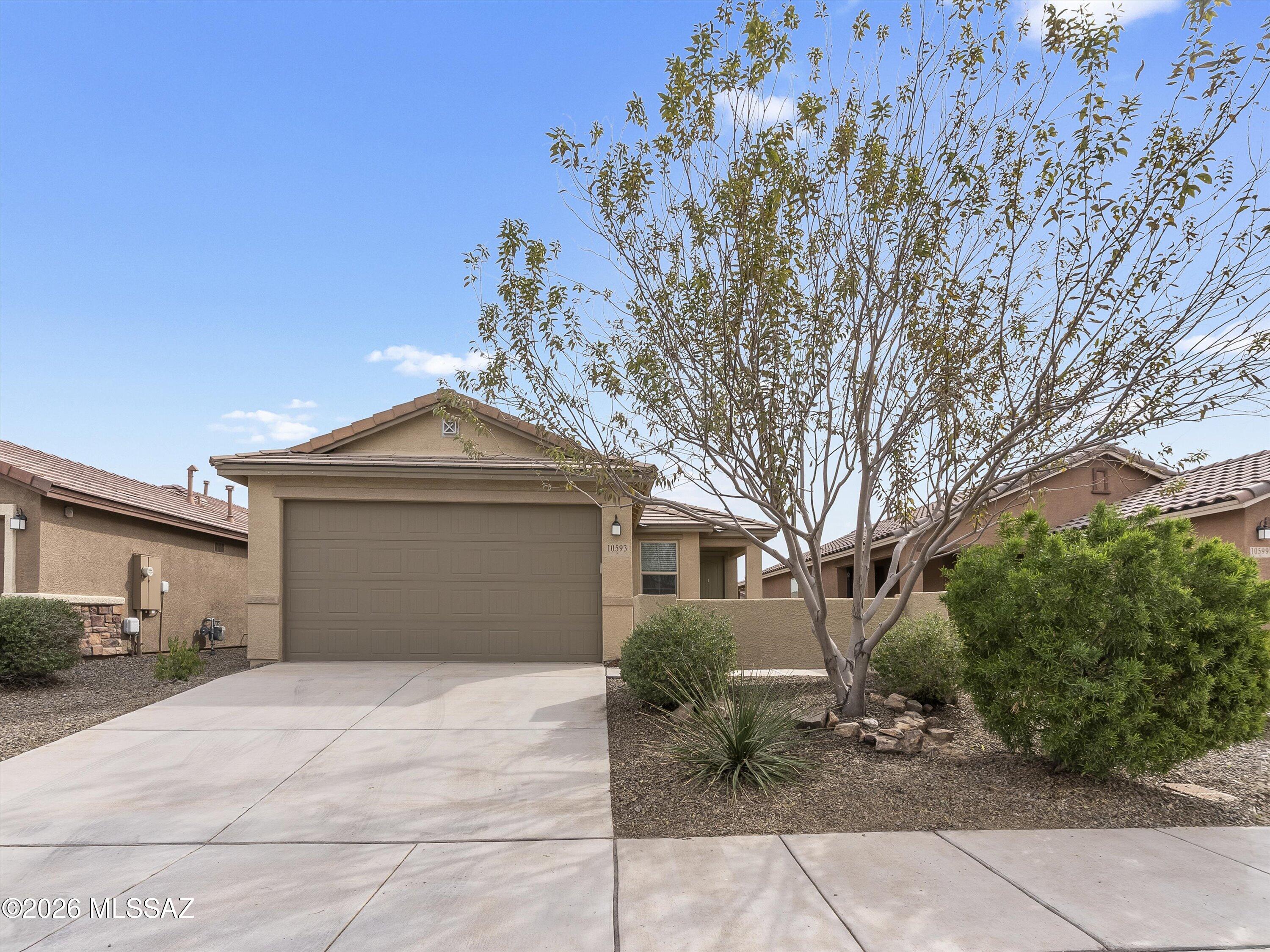 Move-in ready home in the desirable Gladden Farms community! This newer, less than 5-year-old home offers 3 bedrooms, 2 bathrooms, plus a flexible den that works as an office or dining room. The popular split floorplan features 9' ceilings, great natural light, and tile throughout with carpet only in the bedrooms. Enjoy a 2-car garage, fresh interior paint, and a private backyard that backs to common area. All appliances convey, making this home truly move-in ready. Located near parks, walking paths, new schools, shopping, dining, and downtown Marana. Short sale subject to lender approval. Terms and timeline not guaranteed.