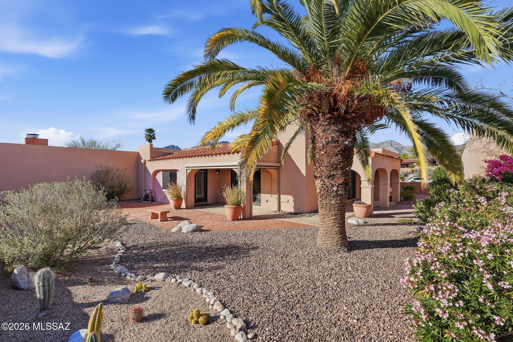A Well Maintained & Exceptional Home in the popular Fairfield Community, Mountain & City Views. This home offers Privacy, an easy care Large Wrap around Patio Courtyard, with the Lot extending beyond the Backyard Wall, to appreciate the Natural Beauty of the Desert Landscape. An Open Floor Plan Design with an abundance of Windows & Skylights, Ceiling Fans throughout. Custom Kitchen & Baths, Instant Hot Water System under the Kitchen Sink, Water Softener System, Custom Built-Ins with Window Seat off kitchen in the Dining/Sitting area, FP, Owners Suite is large with Bonus Room for office, study, exercise room or reading room, Large Walk-in Closet. Laundry room off Bonus Room. Added Storage in Garage, two Community Pools & Spa, Tennis/Pickleball, Convenient to Shopping & Restaurants.