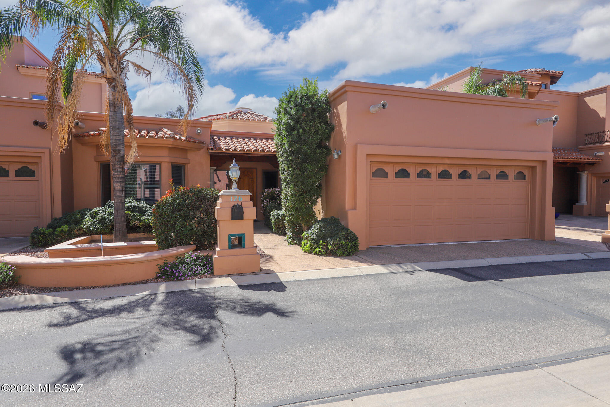 Beautiful townhome style home located in Villa Escondido Condos neighborhood that is convenient to shopping, restaurants, hospitals, & parks. Home features a split floorplan with 2 bedroom, 2 bath, a 2 car garage. Step inside to 1,636 square foot of living space, a large living room with cathedral ceiling with a  fireplace, wooden shutters on windows, and tile throughout the whole house. Kitchen is spacious with lots of storage cabinets, ample counter top space, and a nice breakfast area. The primary bedroom is large, with a two closets, large soaking tub, dual vanity, and has its own door to the patio. HOA Includes: Community pool & spa, front yard landscaping, exterior maintenance (stucco/paint), exterior insurance, private streets, water, sewer, and trash. COME SEE IT TODAY!