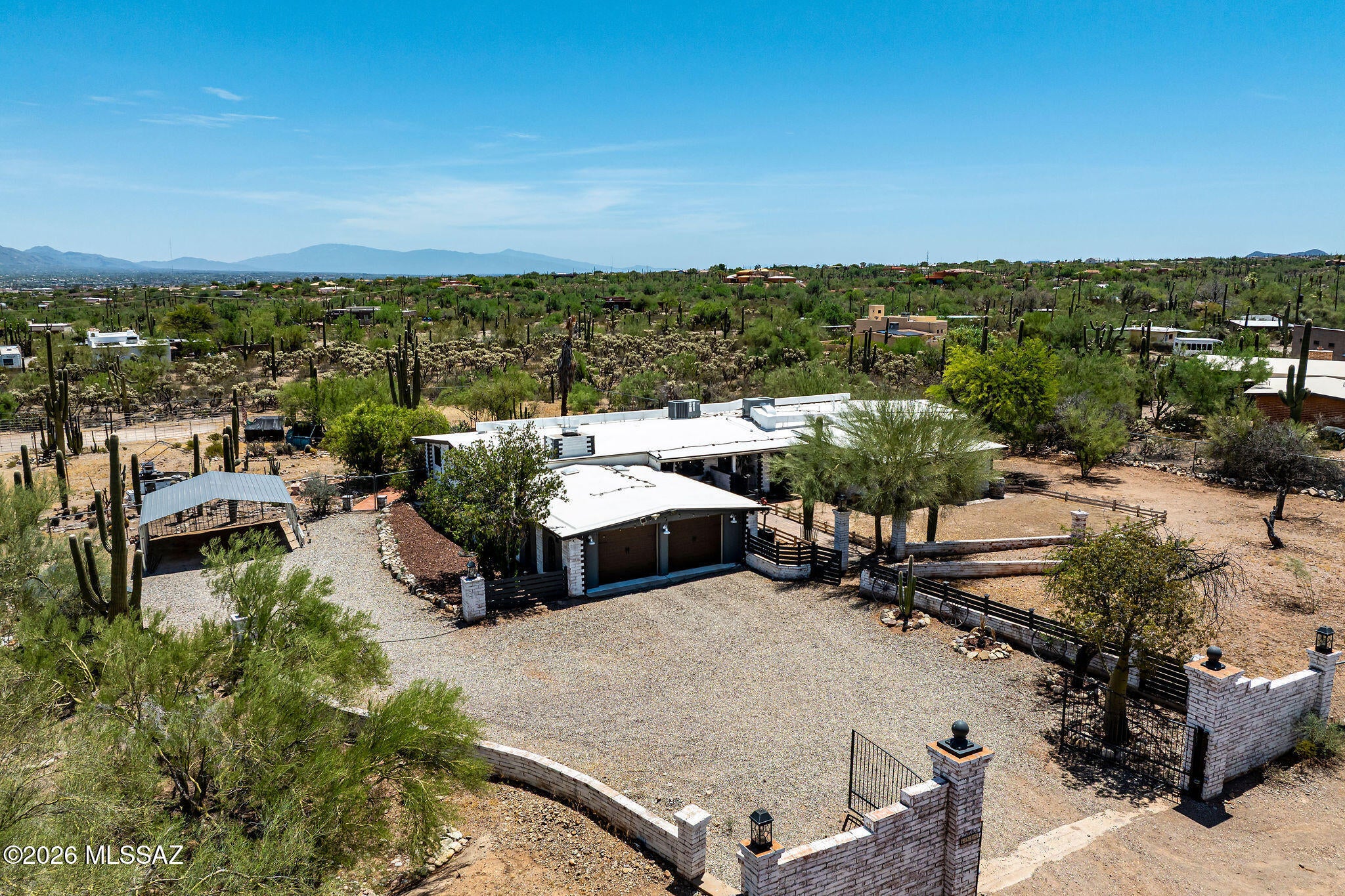 The Best of Both Worlds--Luxury Interior Meets an Incredible Animal Ranch
Experience. Just lowered to $875K , well under appraised value.  This Property is also available to lease or rent. The perfect blend of beautifully remodeled living spaces and an exceptional equestrian lifestyle on this stunning 3.3-acre property-offering breathtaking mountain and city views. With over 3,400 square feet, 5 bedrooms, multiple flexible living spaces, and more than $200,000 in recent upgrades, this one-of-a-kind property is move-in ready.
Step inside to a spacious, open great room featuring soaring vaulted ceilings, a beautiful fireplace, and an inviting dining area. The upgraded kitchen is designed for both everyday living and entertaining, offering custom cabinetry, granite countertops, a large breakfast bar with seating for five, stainless steel Samsung Bespoke appliances (2023),to include a French door refrigerator, range, a built-in microwave, dishwasher and an undermount sink with spray faucet. The impressive butler's pantry features custom authentic wood doors, plenty of storage and a workspace with electrical outlets, creating both beauty and functionality.
The versatile floor plan also includes a den, office, oversized walk-in pantry, and a large laundry room. The expansive primary suite offers two walk-in closets plus an additional flex room ideal as a sitting area, nursery, home office, or exercise room, complete with a French door leading outdoors. The remodeled primary bath features dual vanities, updated lighting and fixtures, framed mirror, and a stunning walk-in shower with floor-to-ceiling tile. Guest bathroom have also been tastefully updated, while luxury vinyl plank flooring has been installed throughout all bedrooms.
Outside, this property truly shines. Fully fenced and thoughtfully designed for horses and a variety of animals, the grounds include covered horse stalls, corrals, a tack room, barn, workshop/storage building, and additional enclosures with a pond for chickens, ducks, and other small animals. An electric ghost entry gate provides convenient access, while the front yard has been fully snake fenced for added peace of mind.
Entertain family and friends at the ramada BBQ area or relax on the extended brick paver patio beside the tranquil fountain. Mature trees, saguaros, native cacti, extensive landscaping, and abundant solar lighting throughout the grounds create a truly magical outdoor setting. An expansive driveway provides ample parking for guests, trailers, RVs, and recreational vehicles.
Major Recent Improvements Include:
" New roof (2024) with transferable 10-year warranty
" HVAC system replaced in 2021 and regularly maintained
" Commercial-sized septic system (2021)
" Water heater replaced approximately 2021
" Electrical service upgraded from 110 to 200 amps (fully permitted)
" Complete exterior whitewashing and trim painting (2024-2025)
" Rebuilt fireplace and chimney stack
" New garage doors
" Property clearing and extensive landscaping improvements
" Cellular window treatments throughout
" Brick paver front walkway
" Carport
" Barn/tack shed
" Covered horse stalls and corrals
This exceptional property offers the rare opportunity to enjoy modern, upgraded living while embracing the freedom of country life with outstanding equestrian and animal facilities--all just minutes from city conveniences. Close to 1-10, restaurants and shopping and downtown Tucson. This property is also available for Lease