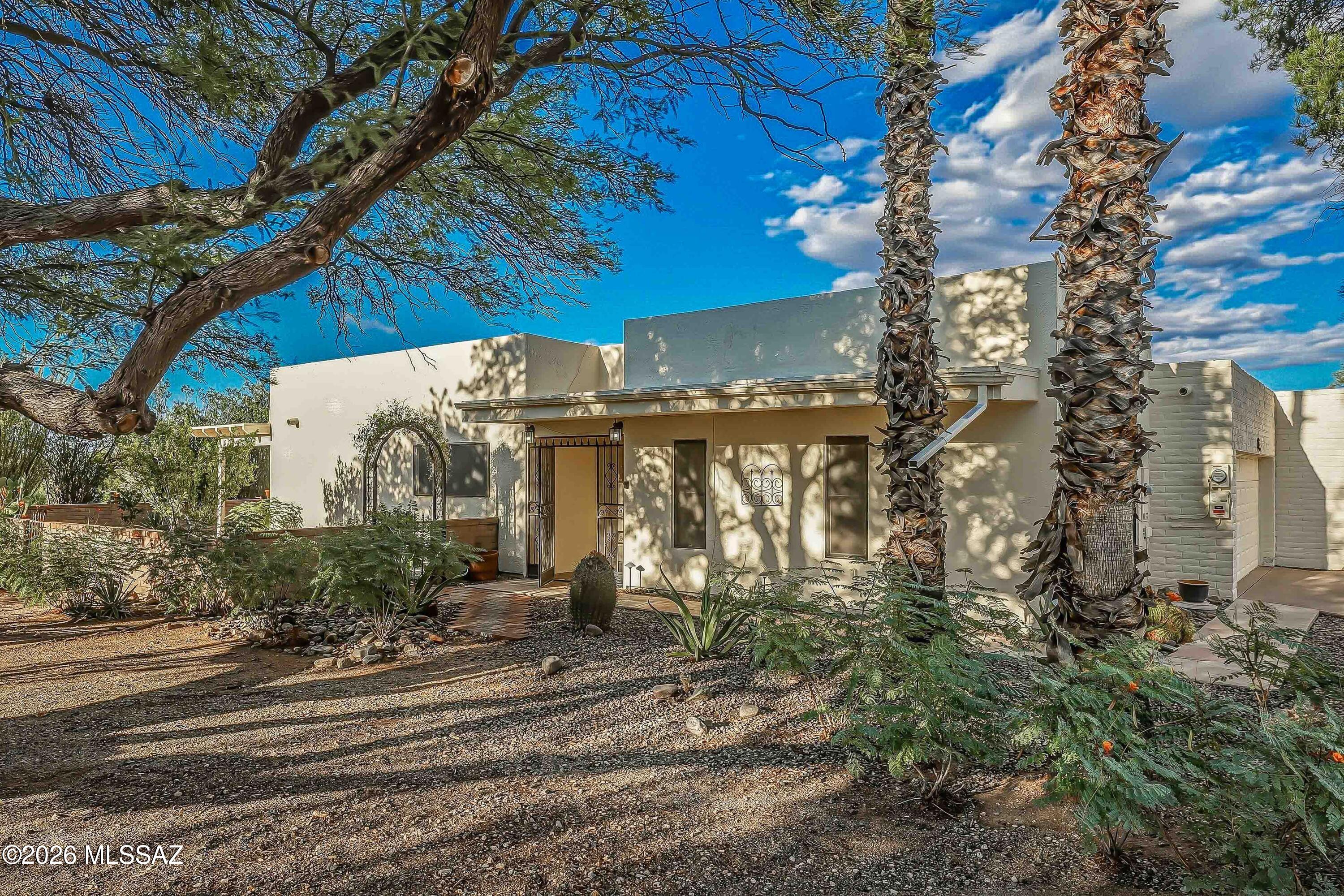 Remember when you thought you couldn't get a really nice 2bed, 2bath, 2car garage townhouse for under $200K in Green Valley? Well you thought right! But here's one that isn't remarkably far away. Situated on a magnificent corner lot, backing up to an arroyo and boasting a relatively young, fully owned, solar system, newer windows and electric heat pump in the highly sought after, and affordable, subdivision of Desert Hills 2, where you are allowed to paint your house a color other than Desert Tan. (Wow, that's a run on sentence if there ever was one.) A fantastic home just steps away from a one of the best GV recreation facilities, Pima Park walking trails and, objectively, the best views in the community. Vacant and ready to move into when you are.