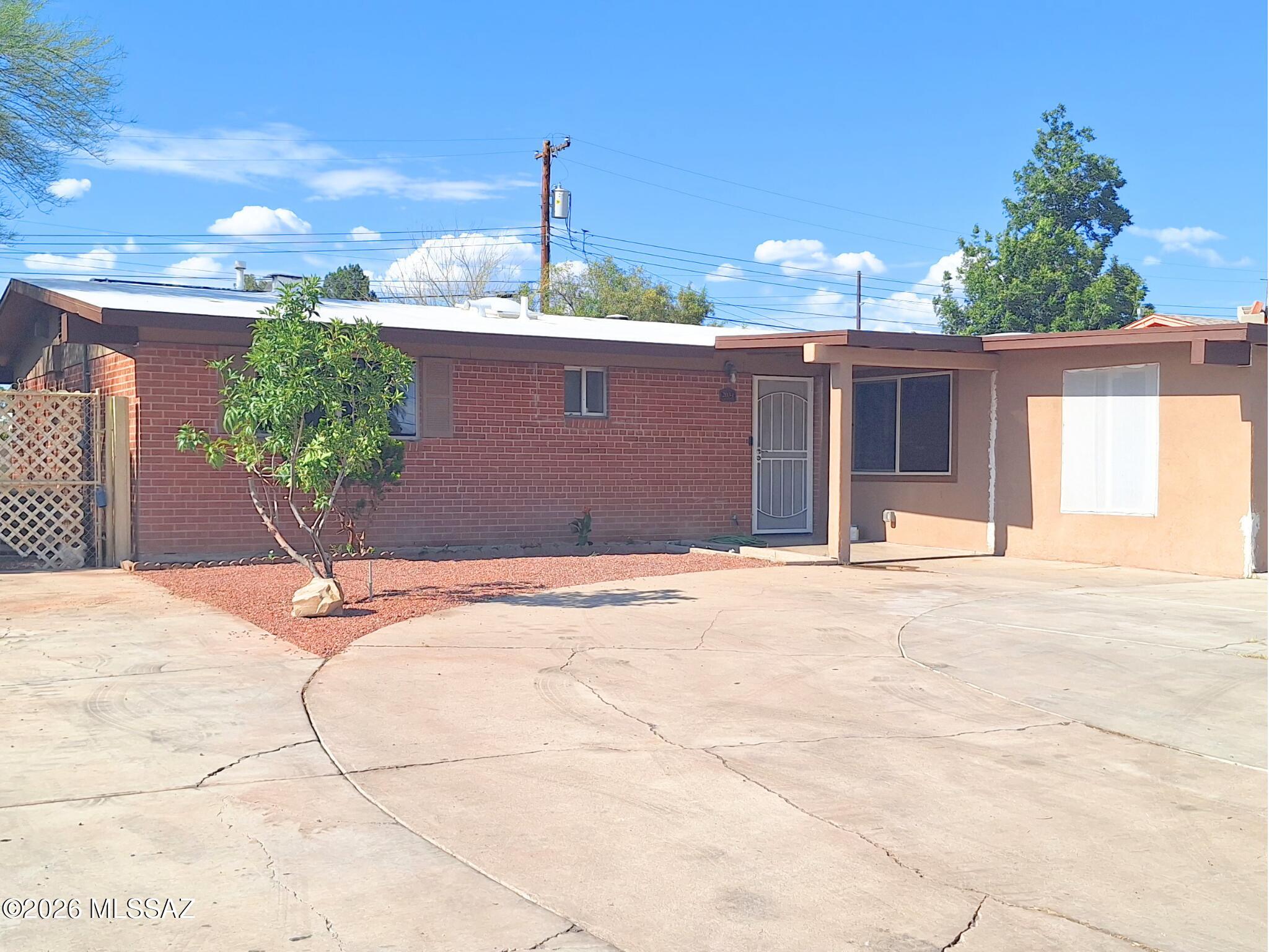 Welcome to 2034 W Amy Drive, a well-maintained 3-bedroom, 2-bath home offering 1,508 square feet of comfortable living space in an established Tucson neighborhood. Built in 1962 and situated on a .154-acre lot, this property blends classic character with functional living. The spacious floor plan provides multiple living areas filled with natural light, while the generously sized bedrooms offer flexibility for families, guests, or a home office. The large backyard presents endless possibilities for outdoor entertaining, gardening, or creating your own private retreat. Conveniently located near shopping, dining, parks, schools, and easy access to major roadways, this home offers both comfort and convenience in a central Tucson location.